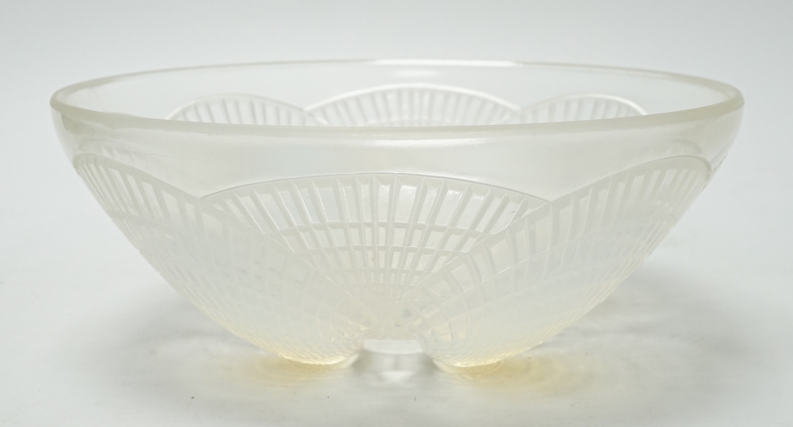 A Lalique opalescent glass Coquilles pattern bowl, moulded ‘’R. LALIQUE’’ mark, 21cm wide                                                                                                                                   