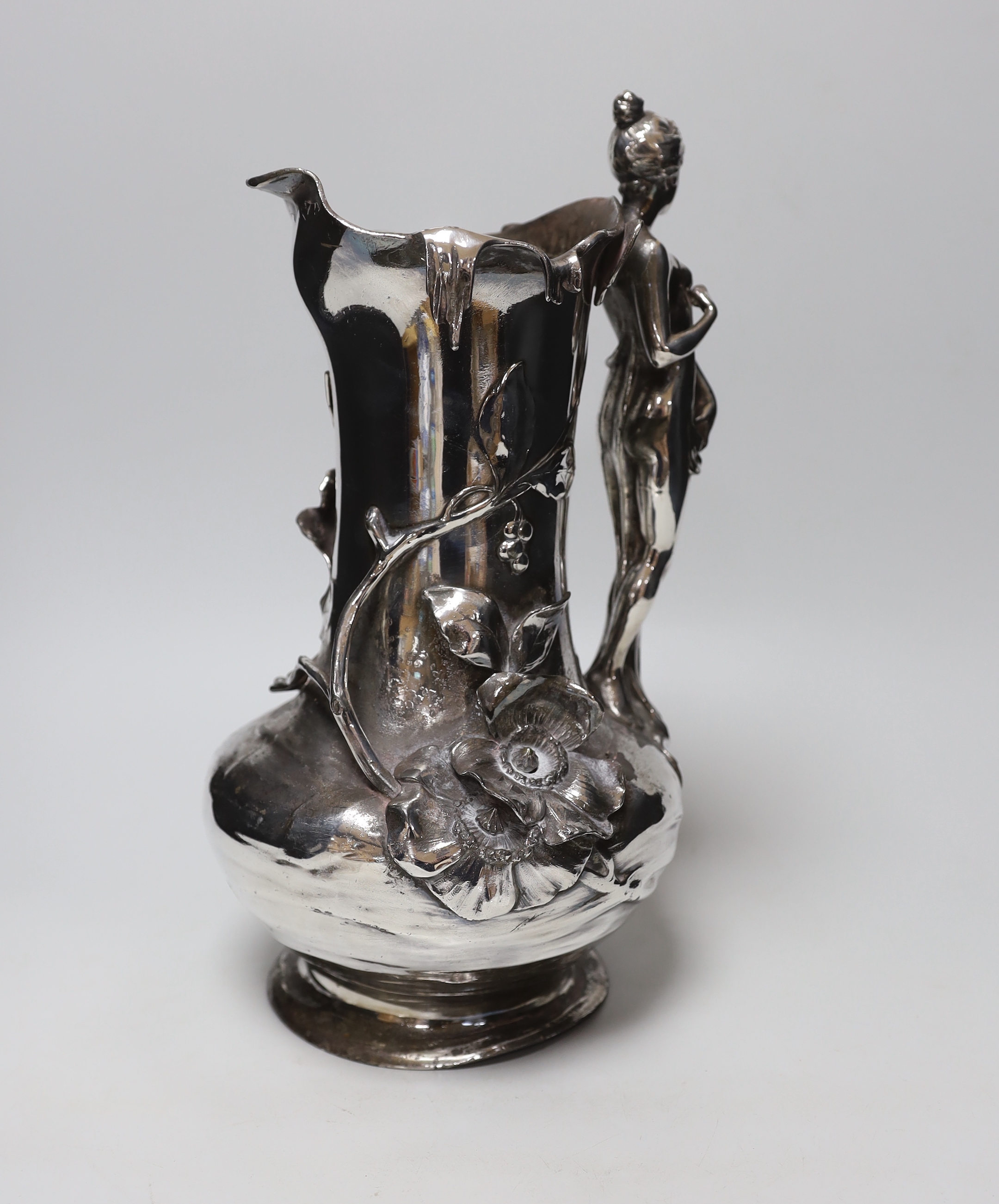 An Art Nouveau WMF-style figural jug, 35cms high                                                                                                                                                                            