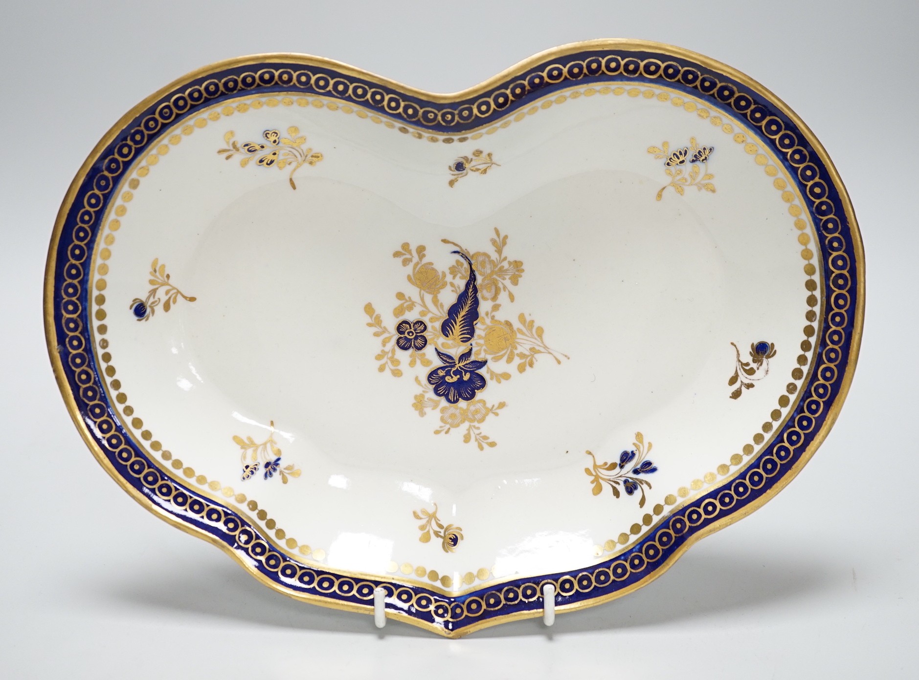 An 18th century Caughley kidney shaped dish with blue and gilt decoration, 28cms wide                                                                                                                                       