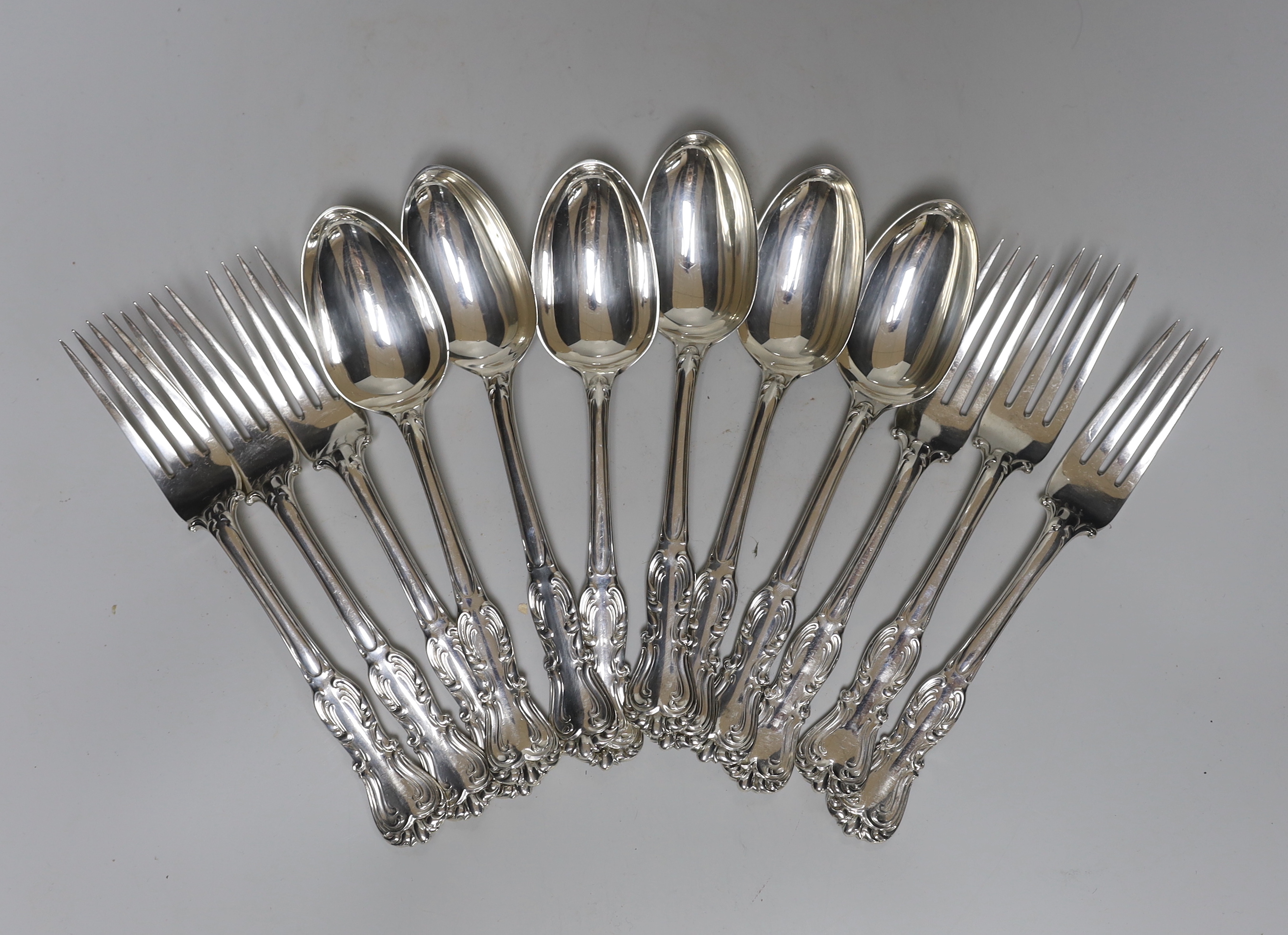 A set of six Victorian silver fancy pattern table spoons and four table forks by John Samuel Hunt, London, 1864 and two similar table forks by George Adams, London, 1848, 37.2oz.                                          