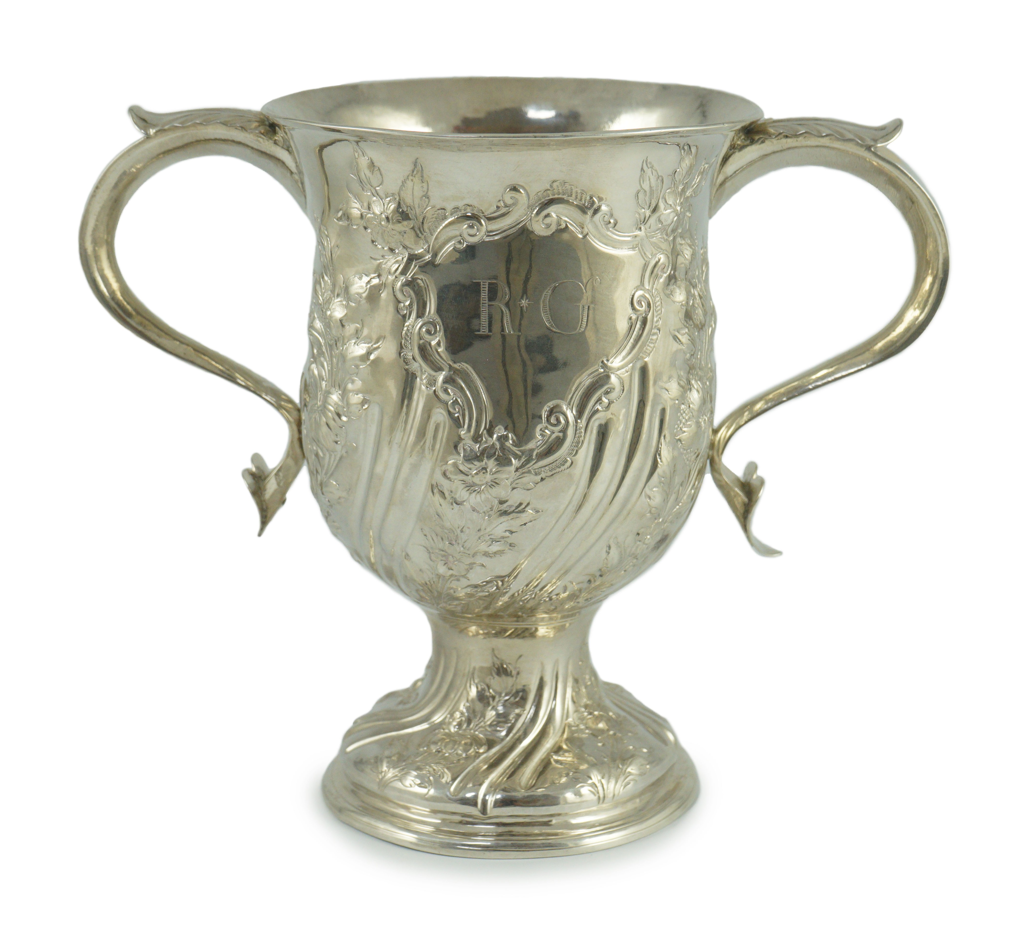 A George III silver baluster two handled pedestal cup, with later embossed decoration, by John Scofield                                                                                                                     