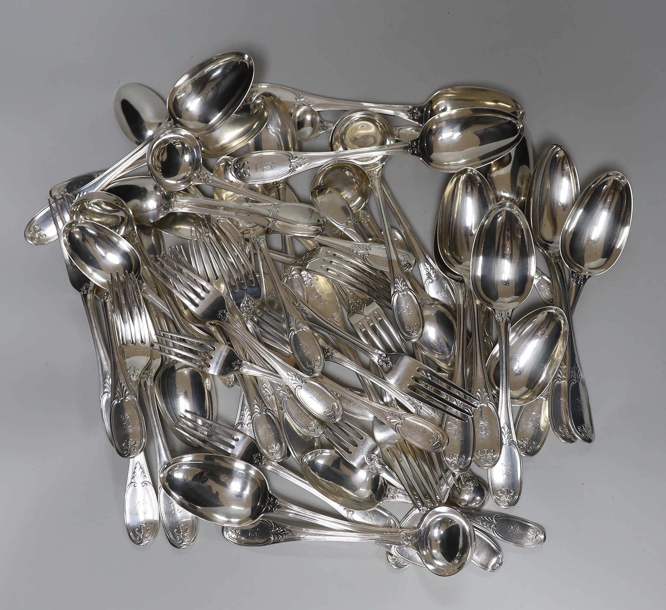 A Victorian part canteen of silver flatware by George Adams, comprising twelve table spoons, twelve table forks, twelve dessert forks, twelve dessert spoons, six sauce ladles and four condiment ladles, London, 1858      