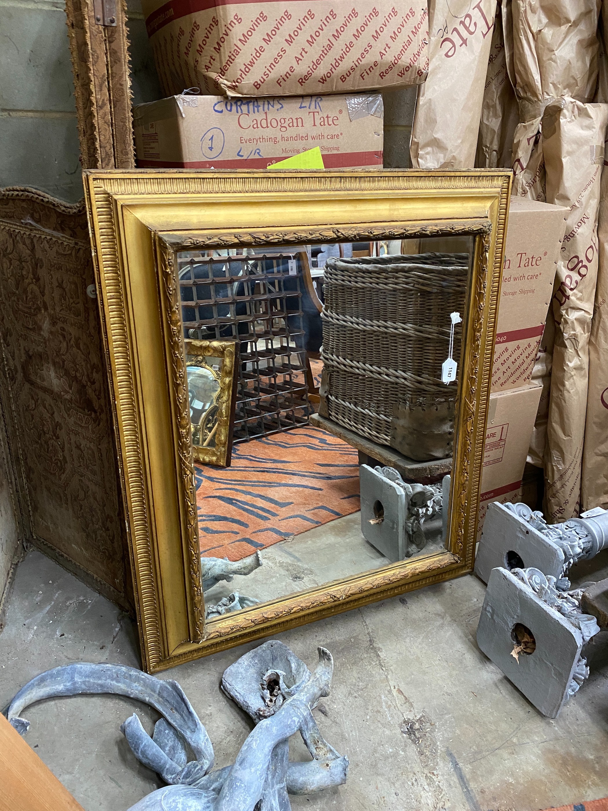 A large rectangular and giltwood and gesso wall mirror, width 95cm, height110cm                                                                                                                                             