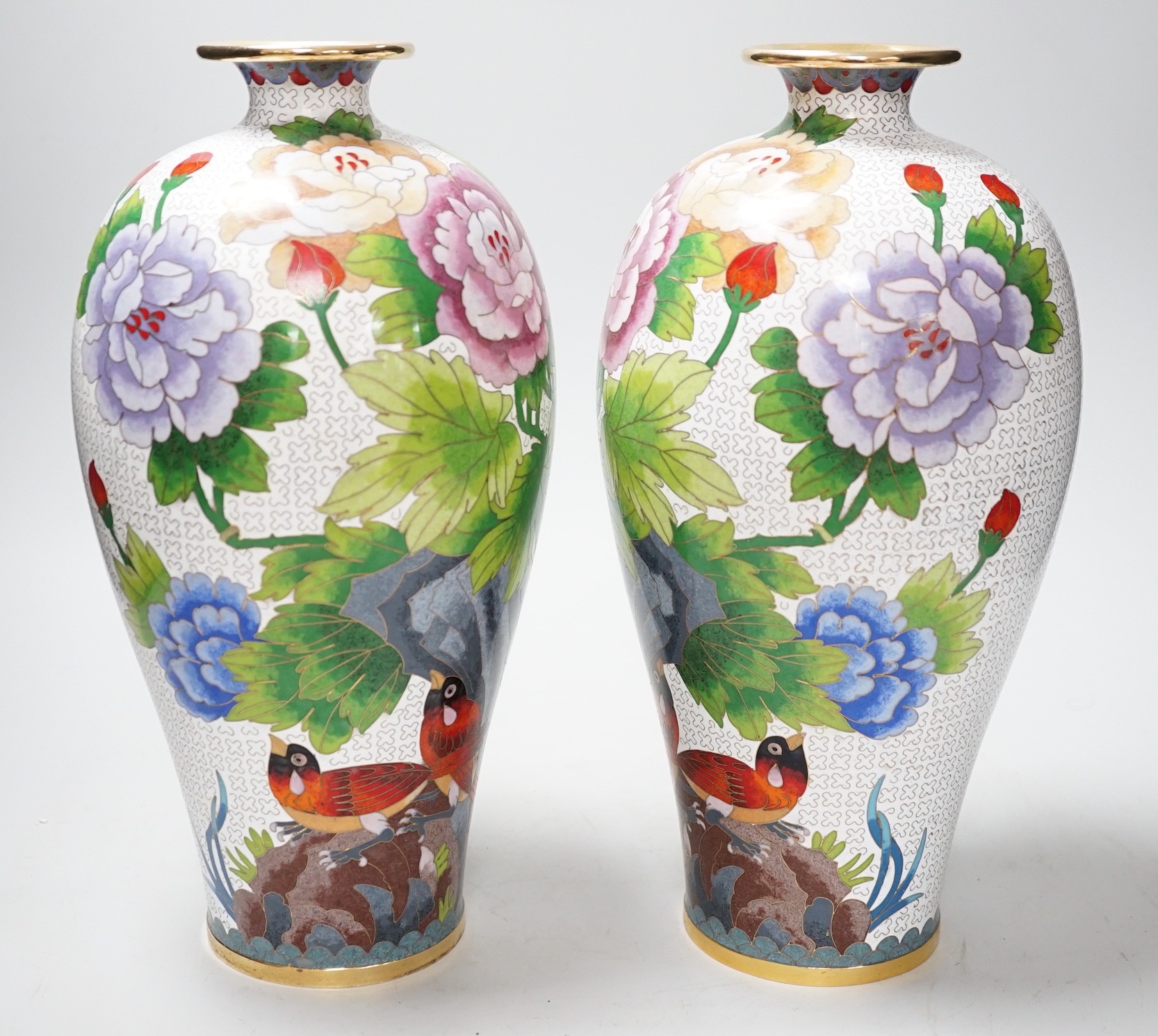 A pair of Chinese cloisonne enamel vases, 31cms high                                                                                                                                                                        