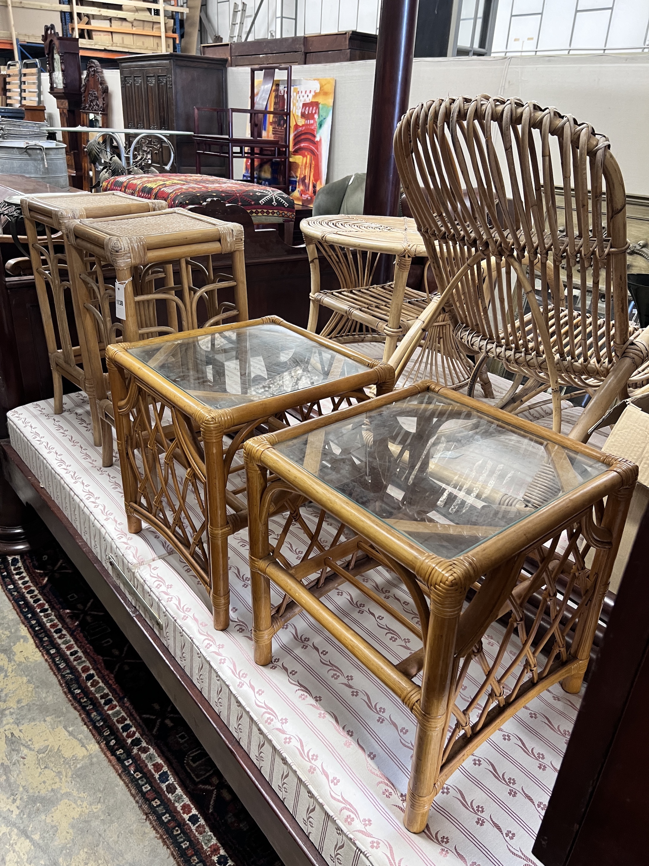 A Franco Albini rocking chair with coffee table, two side tables and a pair of plant stands                                                                                                                                 