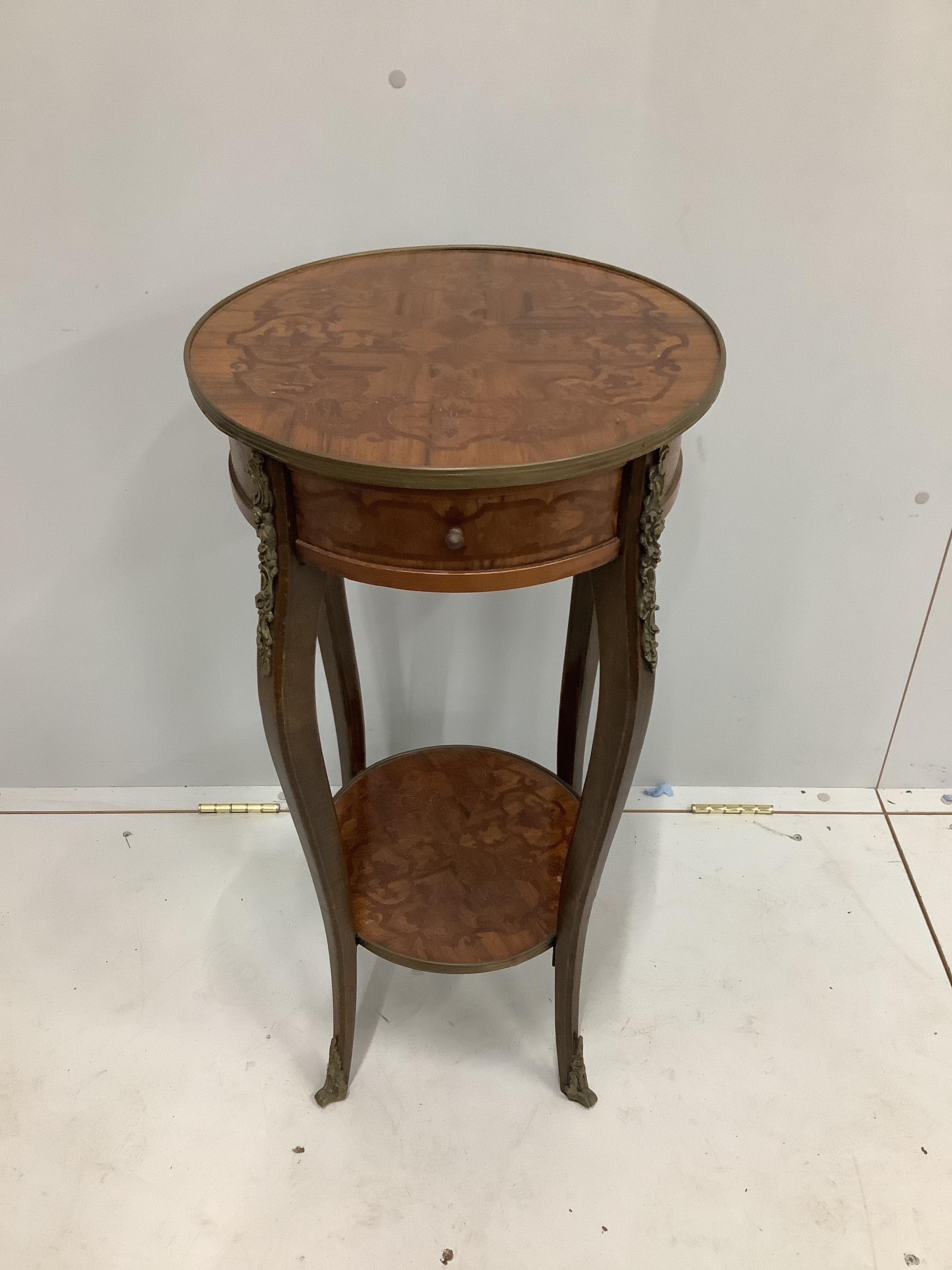 A Louis XVI style circular inlaid kingwood two tier occasional table, diameter 39cm, height 79cm                                                                                                                            
