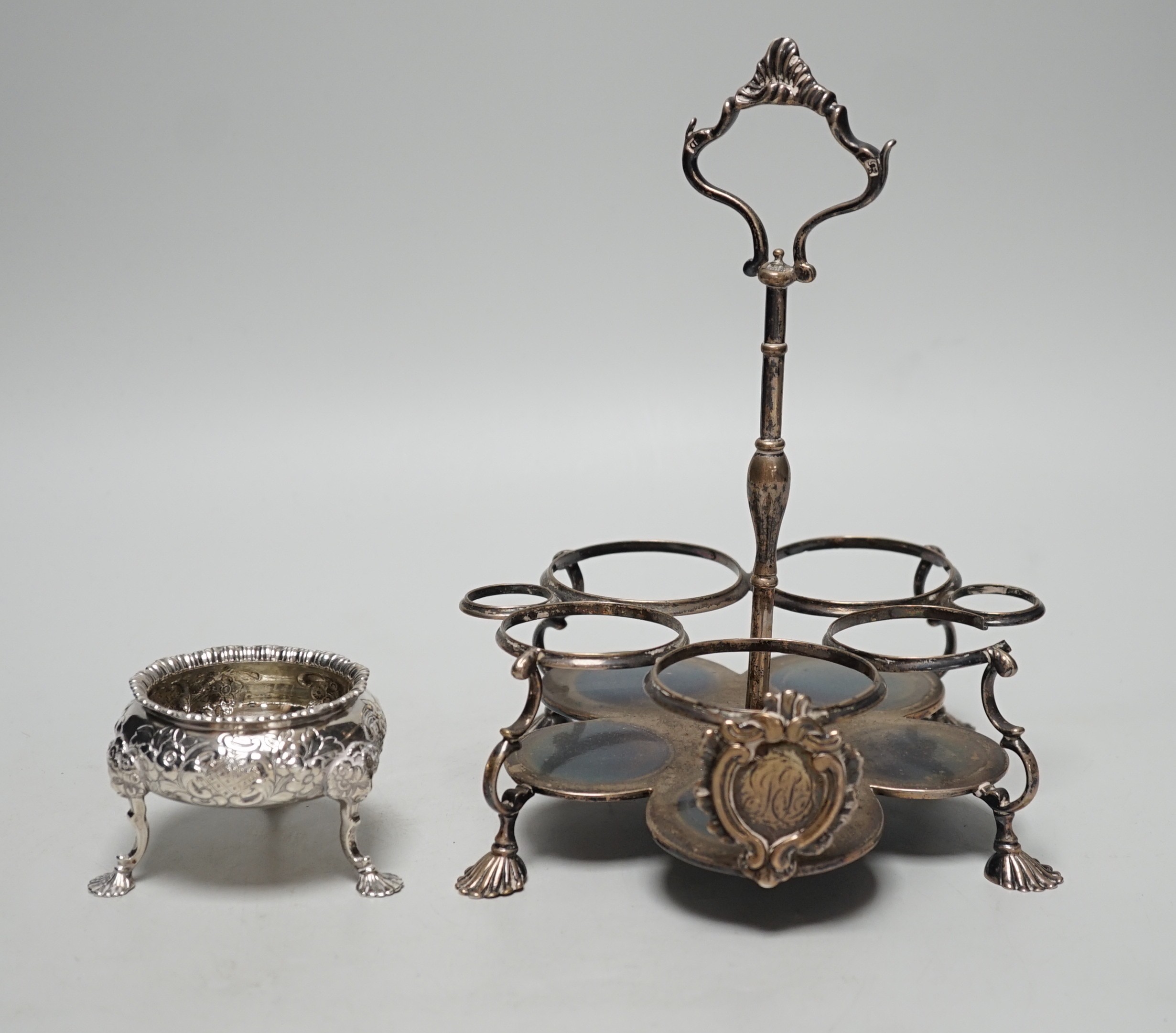 An early George III silver cruet stand, (lacking bottles and piece missing), John Delmester, London, 1763, height 23cm and a Victorian silver salt, 18.4oz.                                                                 