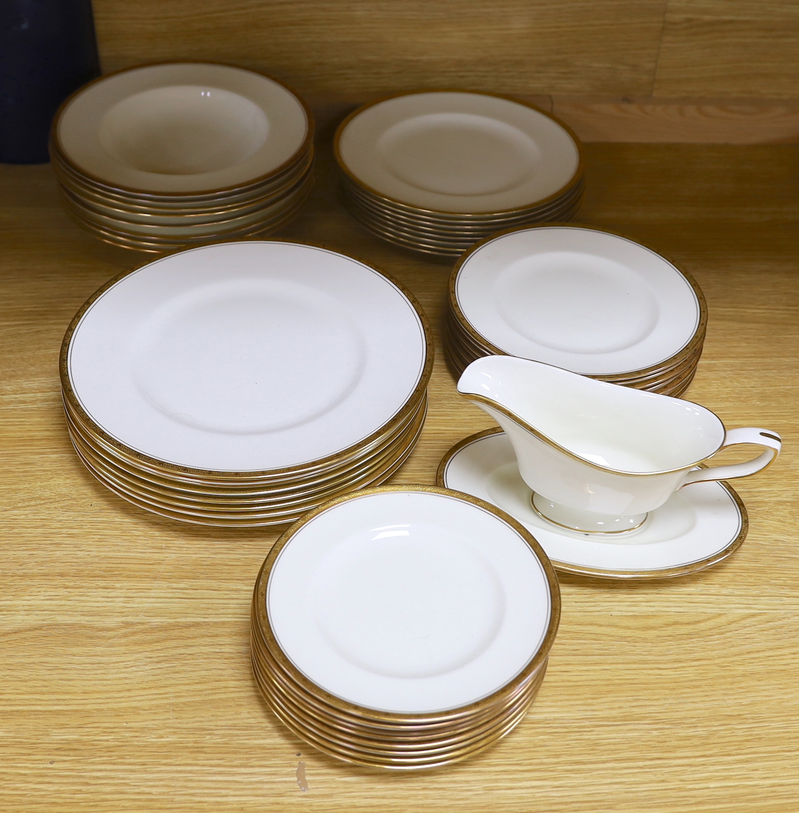 Royal Worcester Chancellor porcelain dinner service including side plates, soup bowls and sauce boat, the largest each 27.5cm in diameter                                                                                   