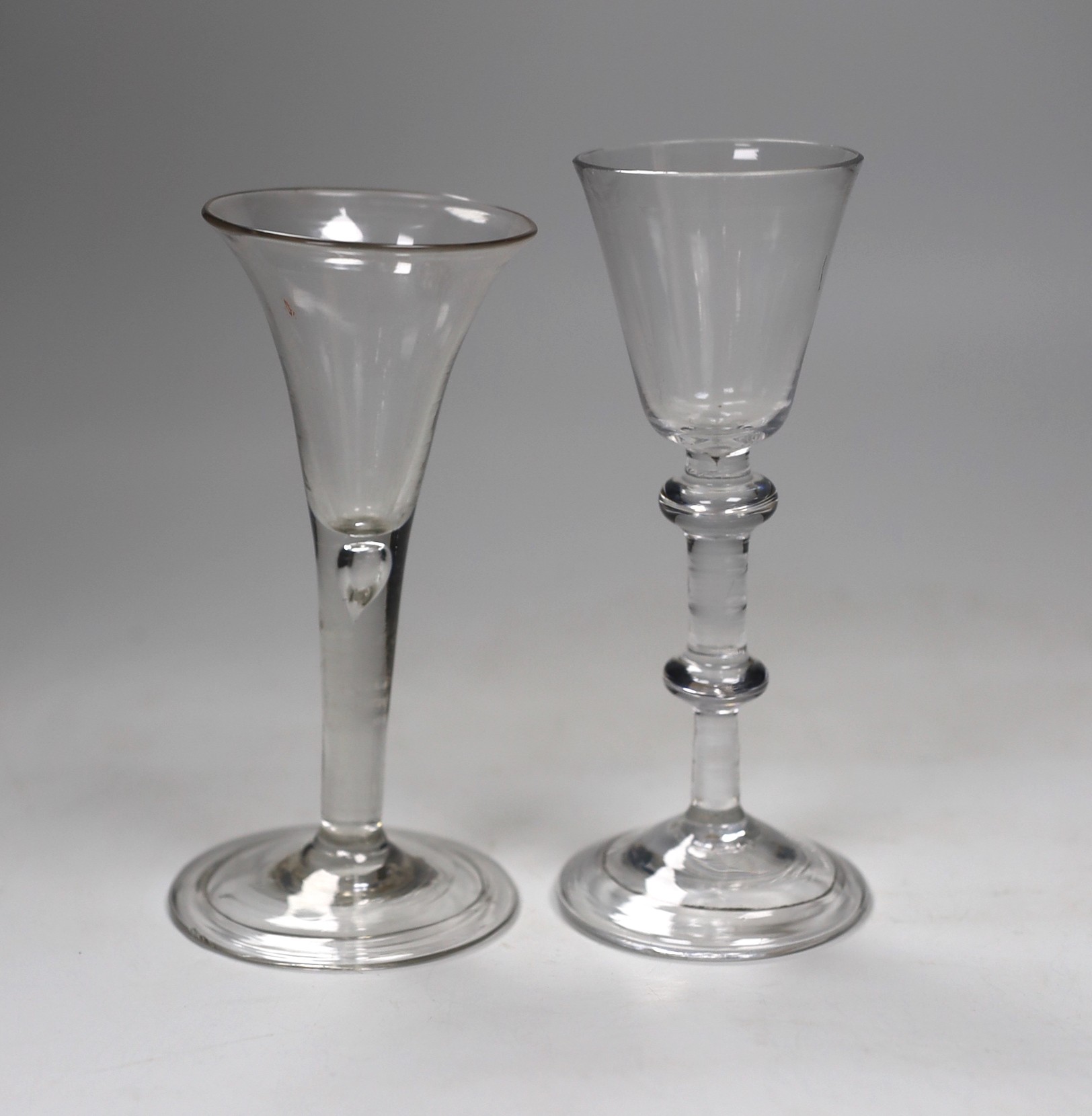 A George II double knopped stem wine glass and a similar ale flute, 16cm                                                                                                                                                    