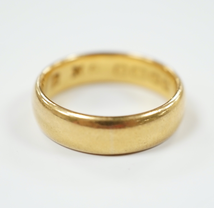 A 22ct. gold wedding band, size N, 7.2 grams.                                                                                                                                                                               