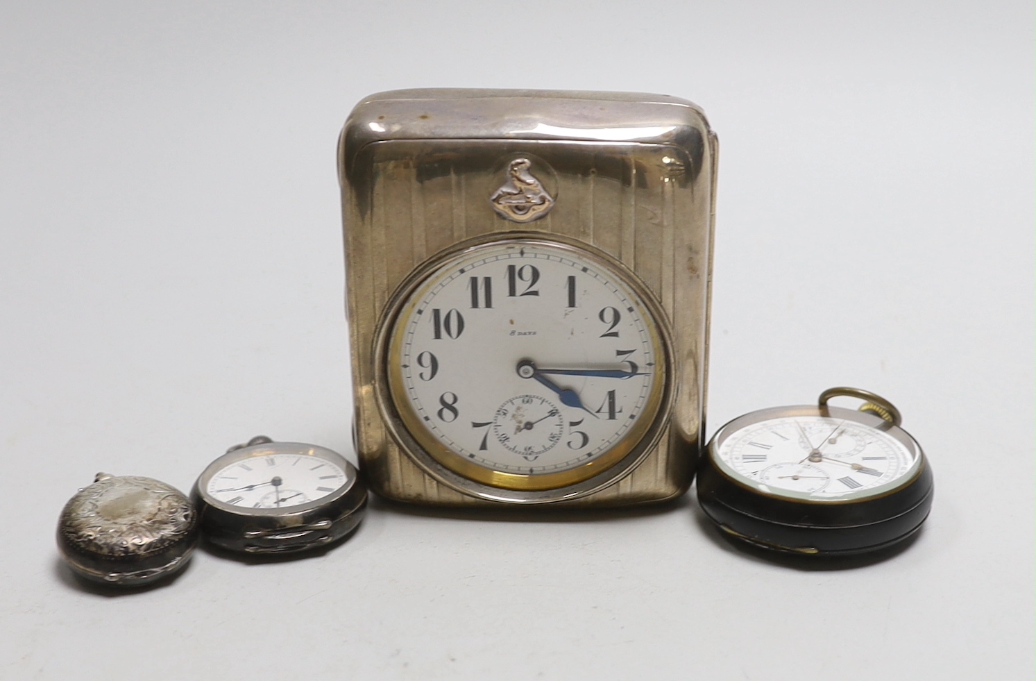 An Edwardian silver sovereign case, Birmingham, 1914, a George V silver travelling pocket watch case, with nickel cased pocket watch and two other pocket watches including gun metal chronograph.                          
