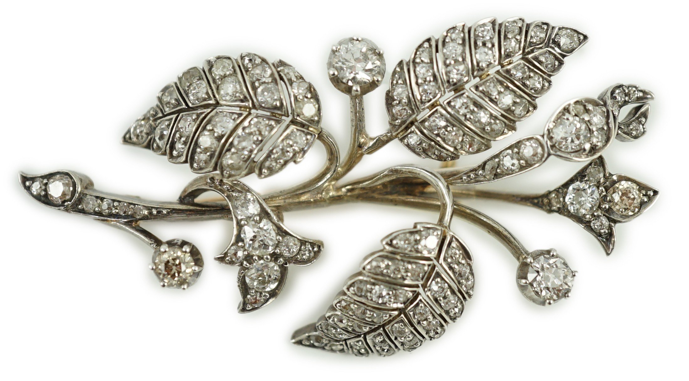 A mid 20th century yellow and white metal, diamond cluster set floral spray brooch, 61mm, gross weight 15.5 grams.                                                                                                          