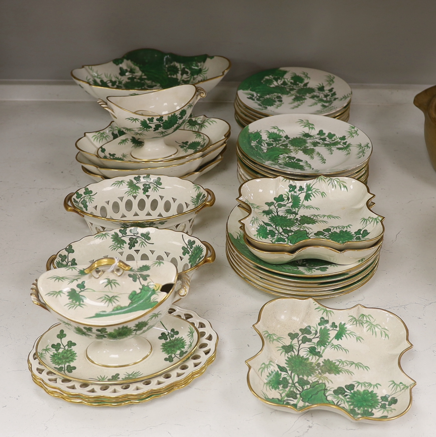 An early 19th century thirty-six piece part dessert service decorated with flowers, the largest 30cm wide                                                                                                                   