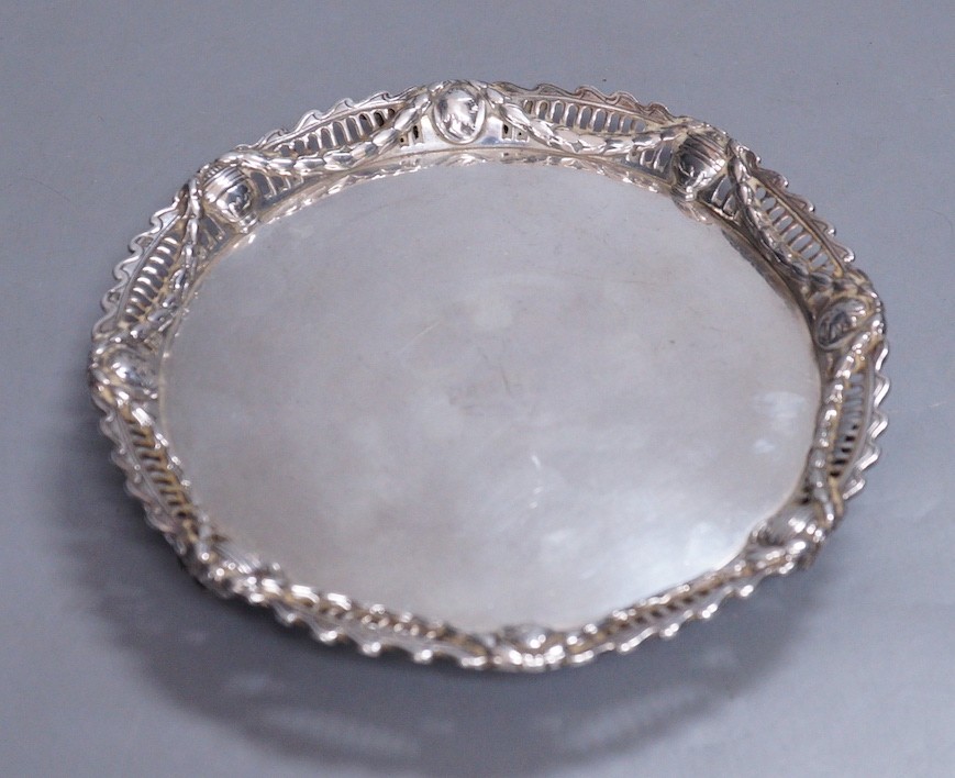 A George III silver waiter with applied pierced silver border, John Cox, London, 1771, 18.1cm, 11.9oz, with later engraved initials and date to the base, (a.f.).                                                           