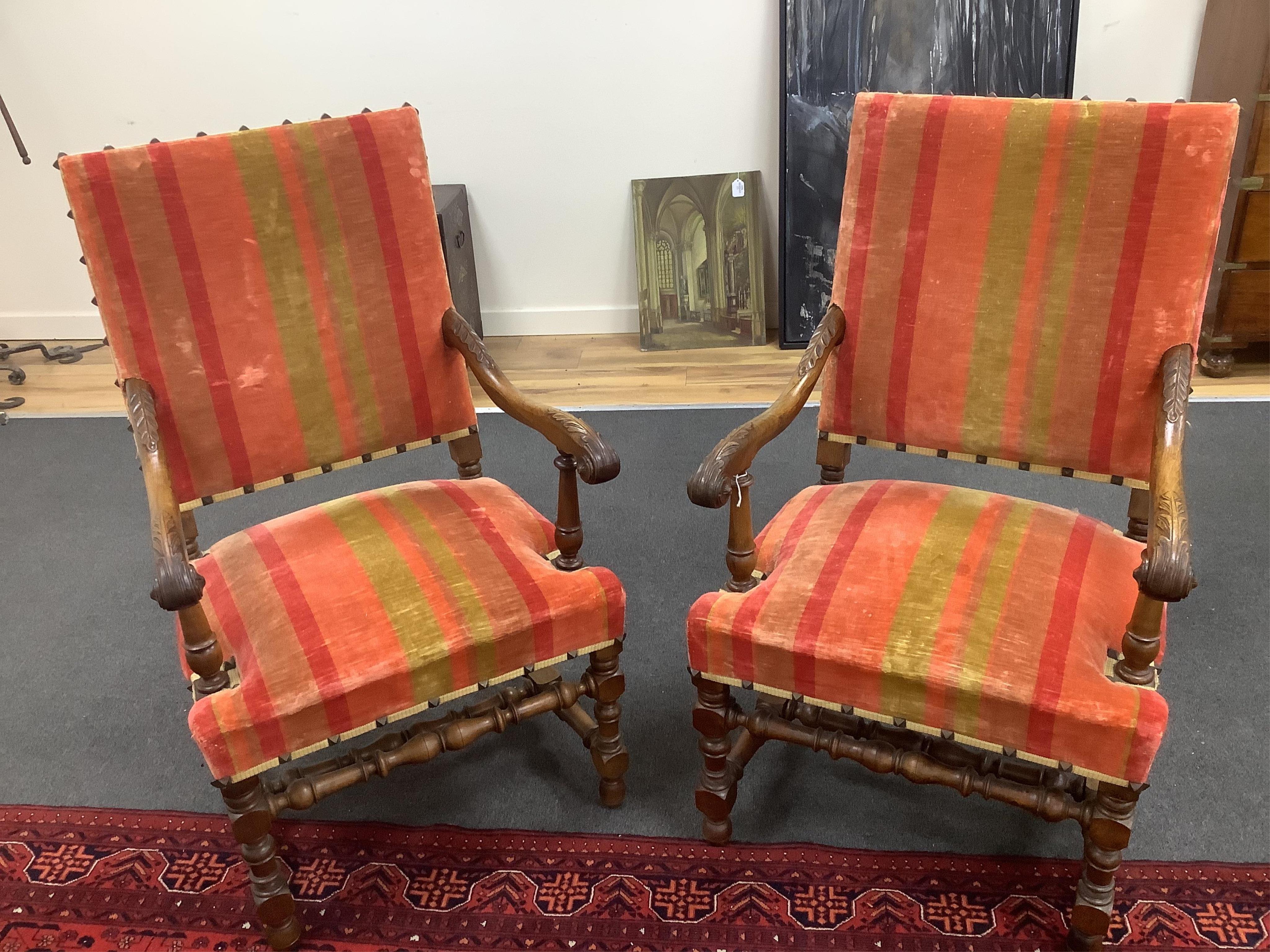 A pair of French walnut elbow chairs, with two matching side chairs, largest 65 x 55cm, height 110cm. Condition - fair                                                                                                      