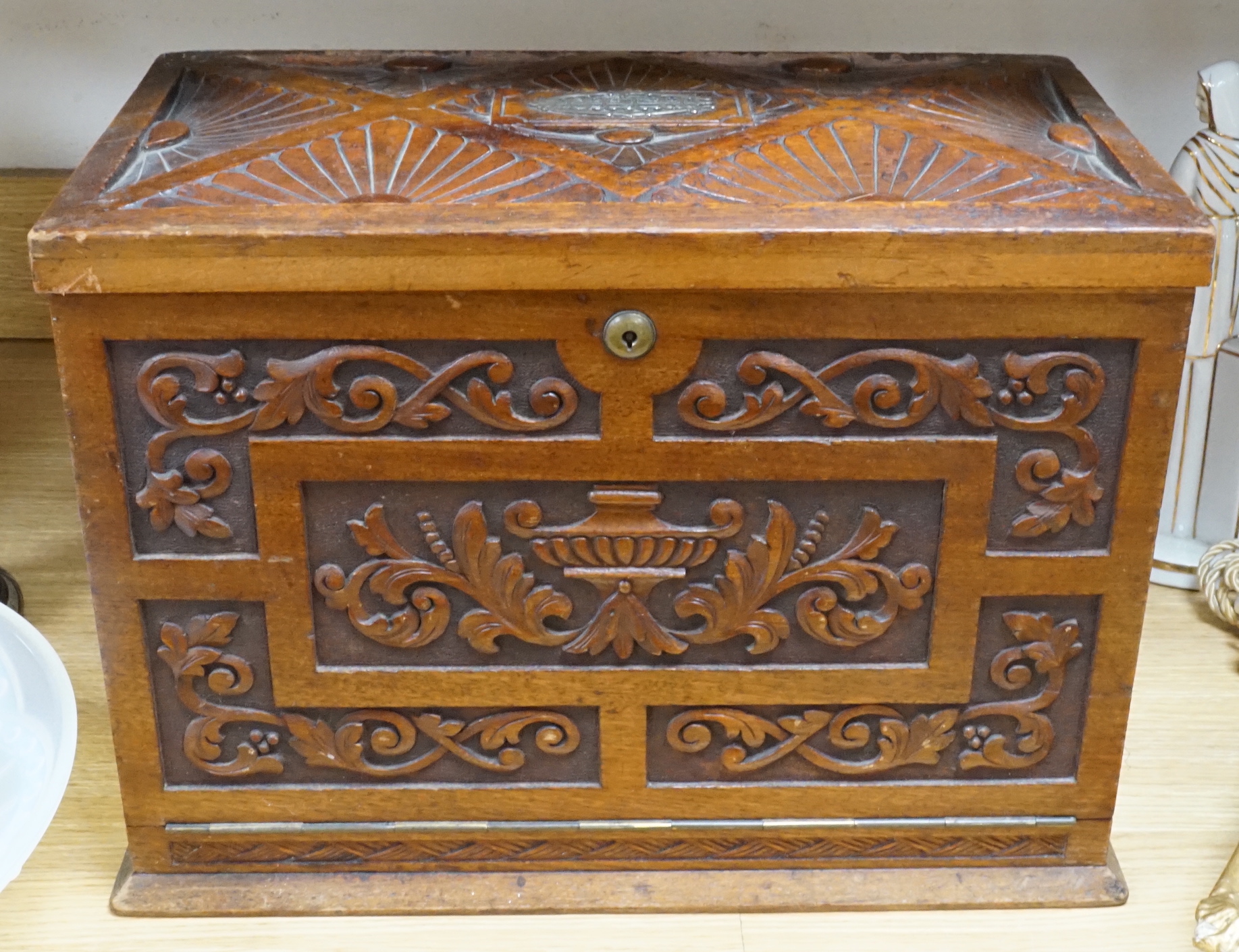 A Victorian carved walnut stationery case with Bramah lock, 42cm wide                                                                                                                                                       