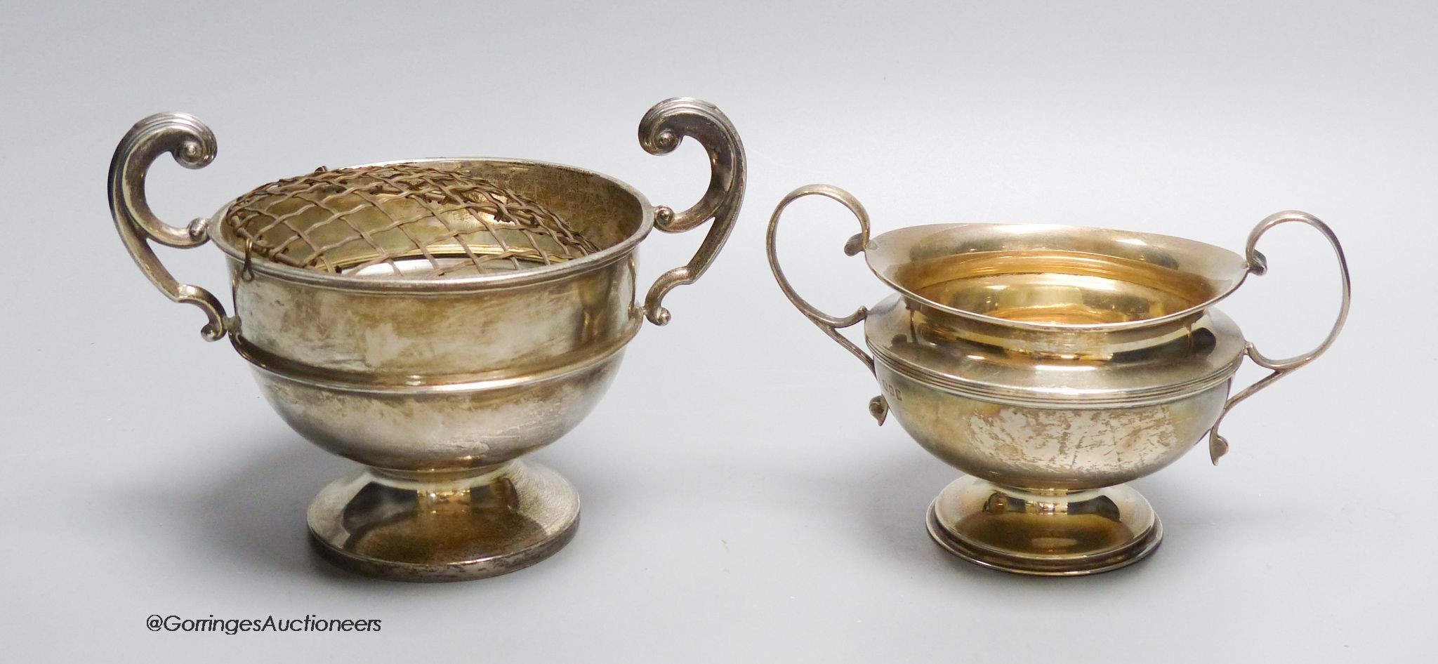 A two handled silver small rose bowl, Birmingham 1929, 4.6oz., 17cm wide, and a two handled silver sugar bowl, London 1920, 6.3 oz.                                                                                         