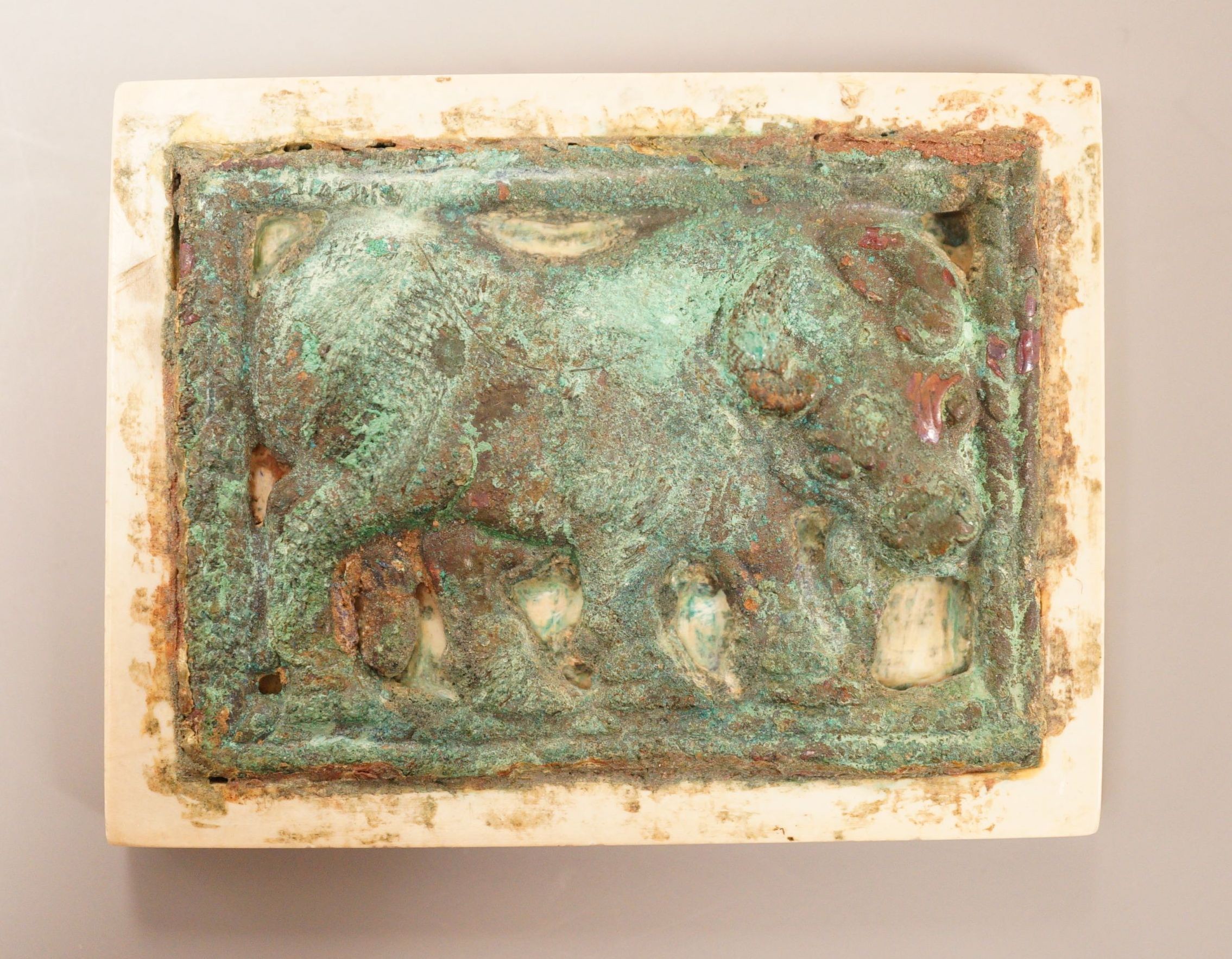 A Chinese burnt jade and bronze plaque                                                                                                                                                                                      