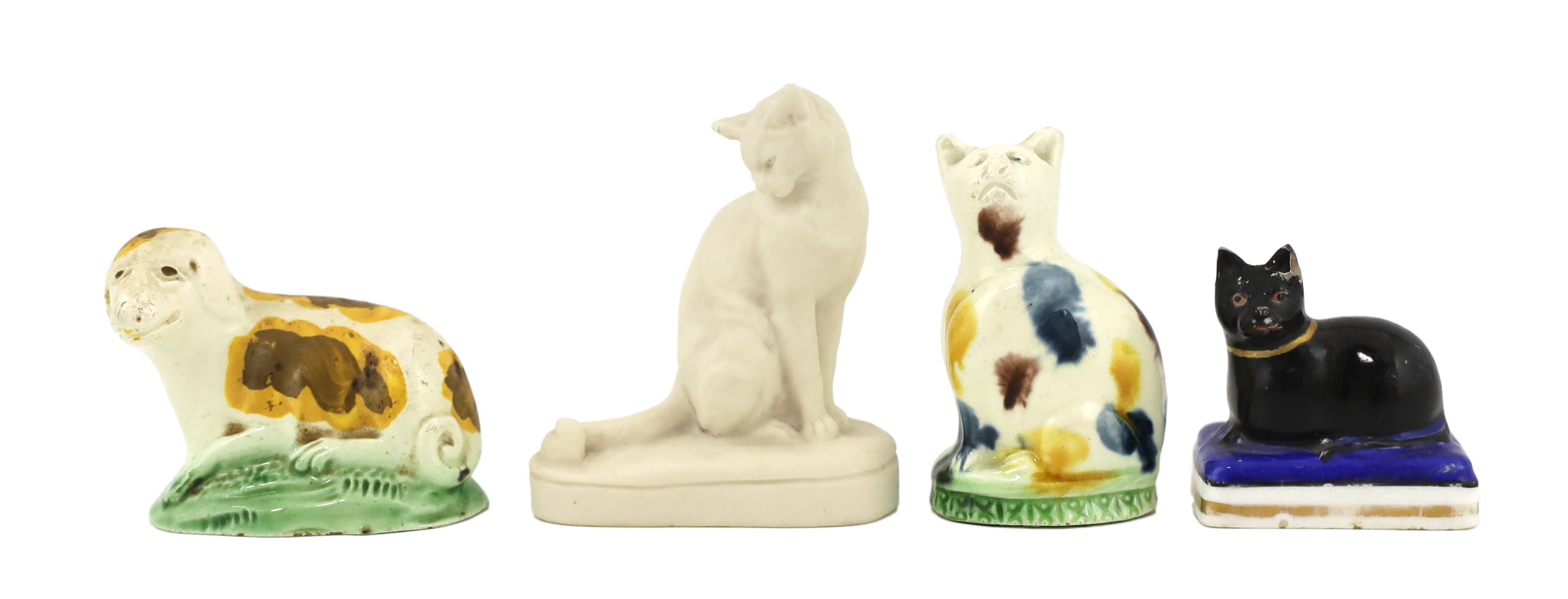 Two Staffordshire creamware models of a seated cat and a recumbent dog, c.1780                                                                                                                                              