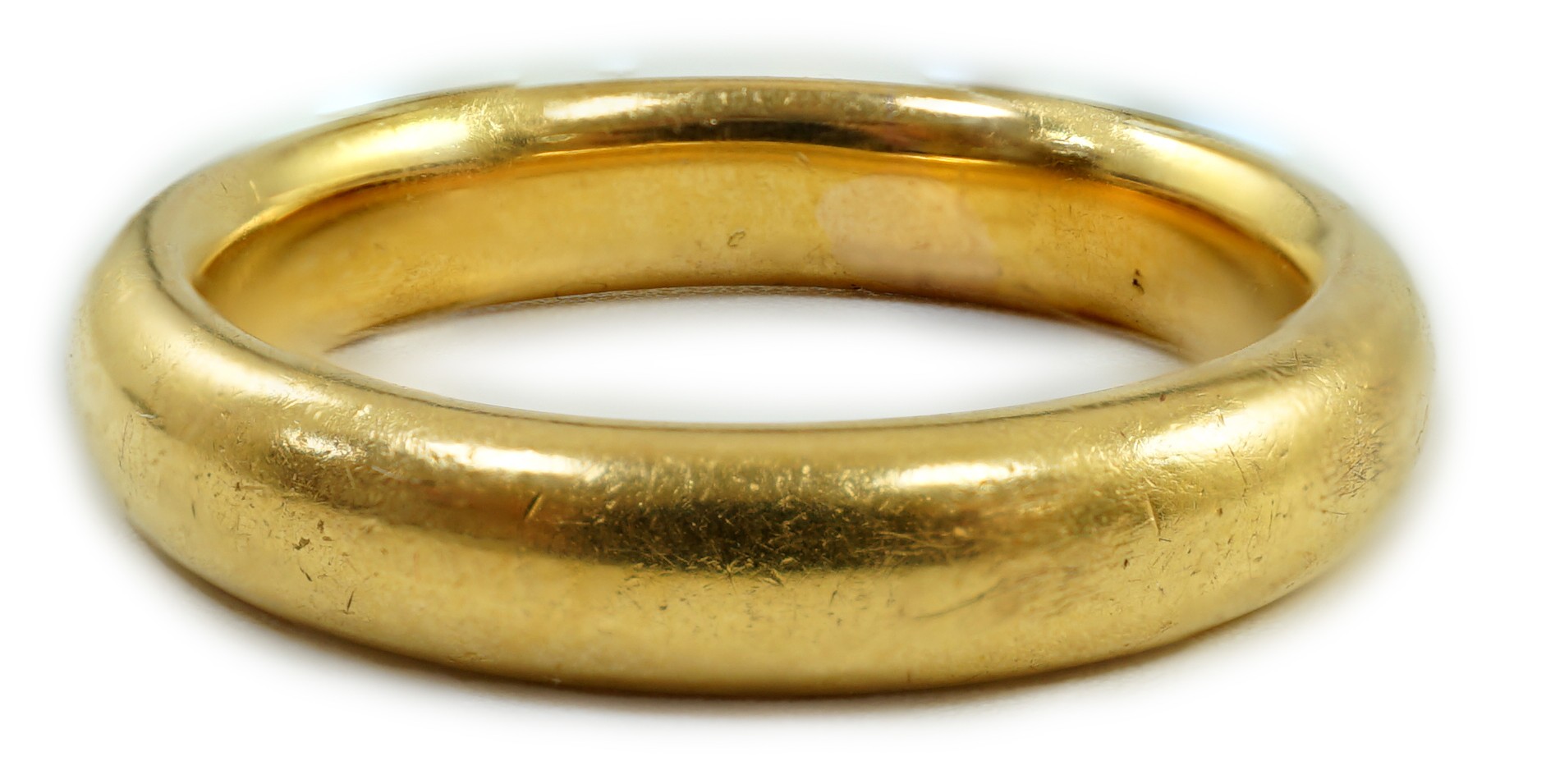 A 1930's 22ct gold wedding band, size M, 7.8 grams.                                                                                                                                                                         