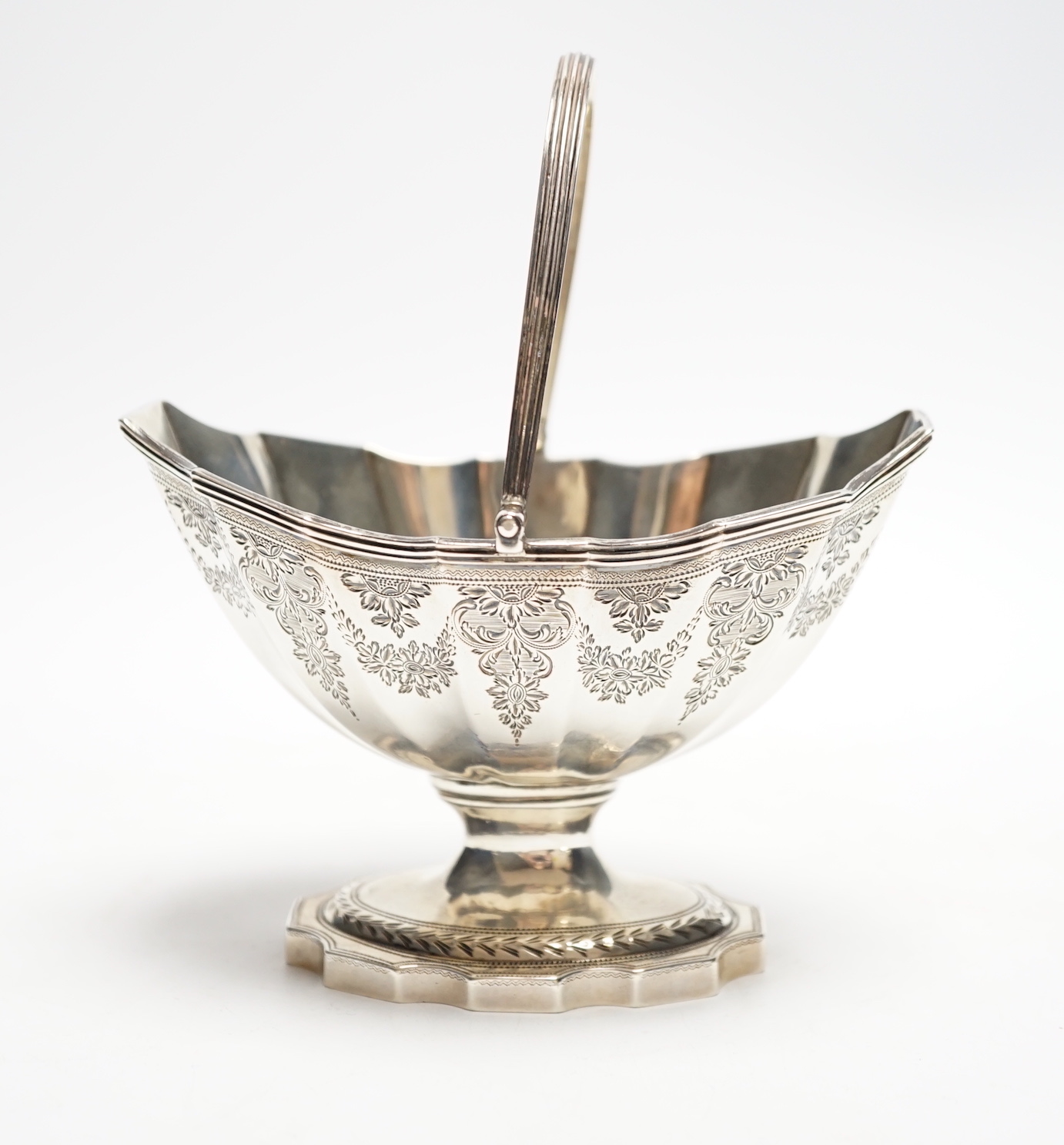 A George III silver boat shaped pedestal sugar basket, John Hutson, London, 1788, length 13.2cm, 5.6oz.                                                                                                                     