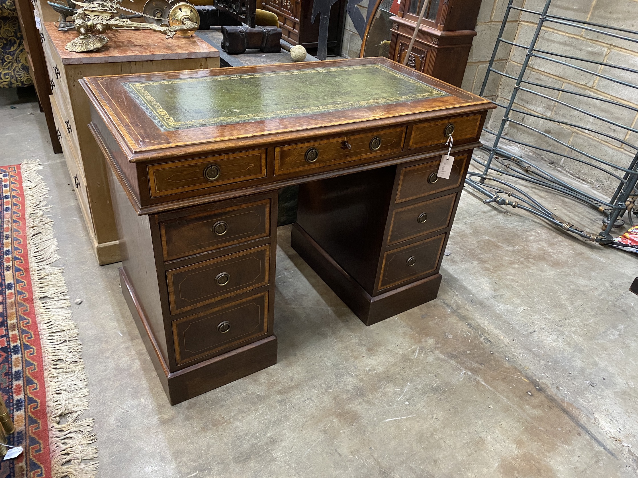 A 19th century and later satinwood banded mahogany pedestal desk, width 105cm, depth 55cm, height 76cm                                                                                                                      