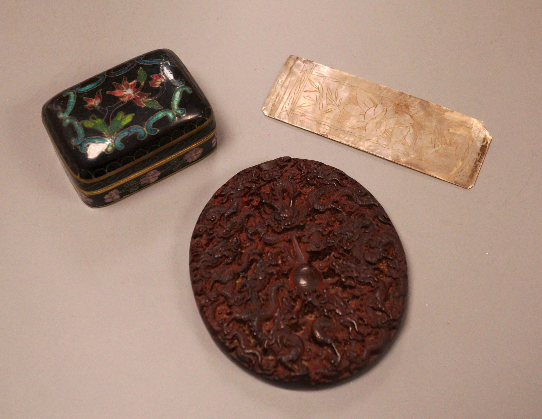 A Chinese cloisonne box, a lacquer carving and a mother of pearl counter                                                                                                                                                    