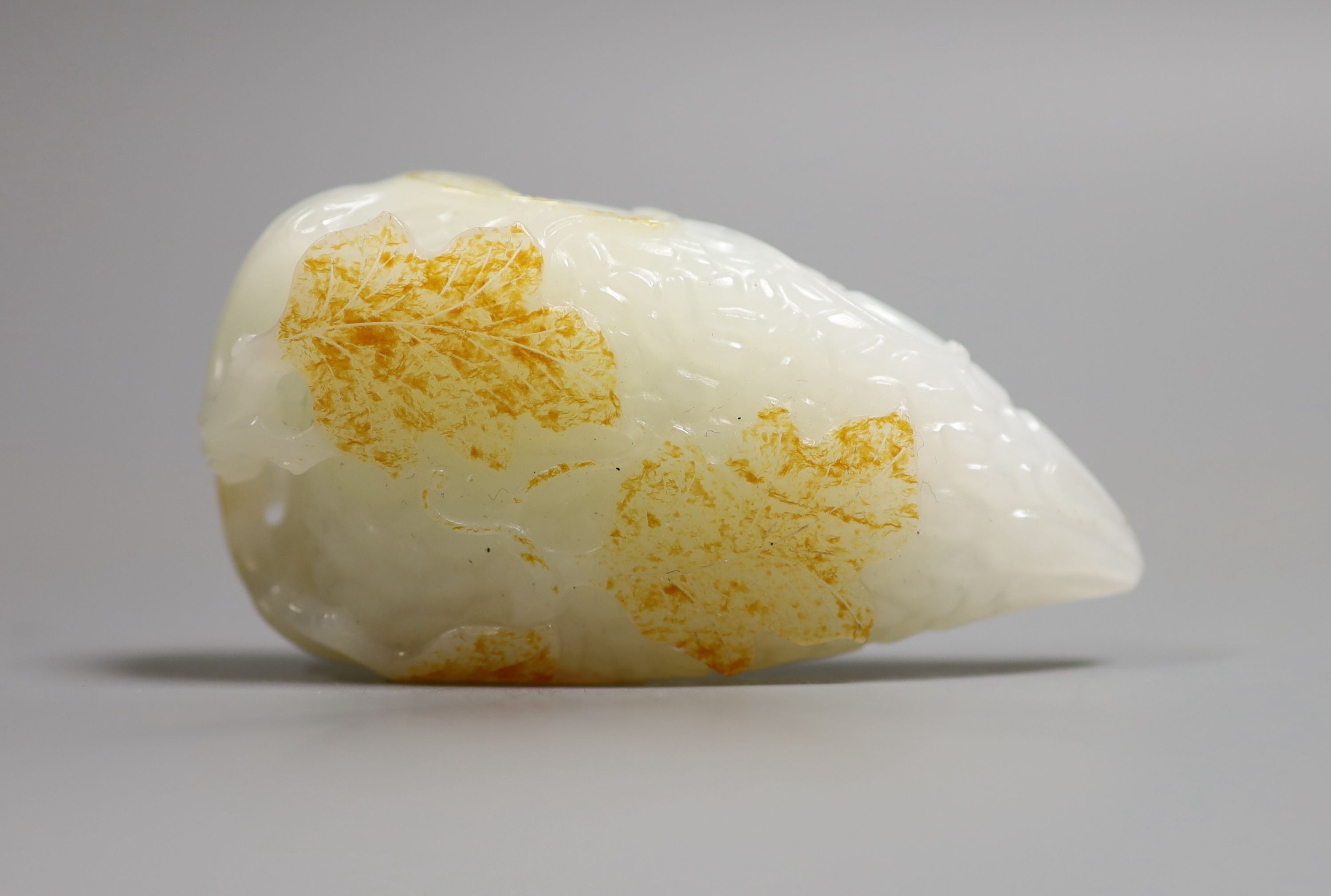 A Chinese white and russet skin jade carving, 7cm high                                                                                                                                                                      