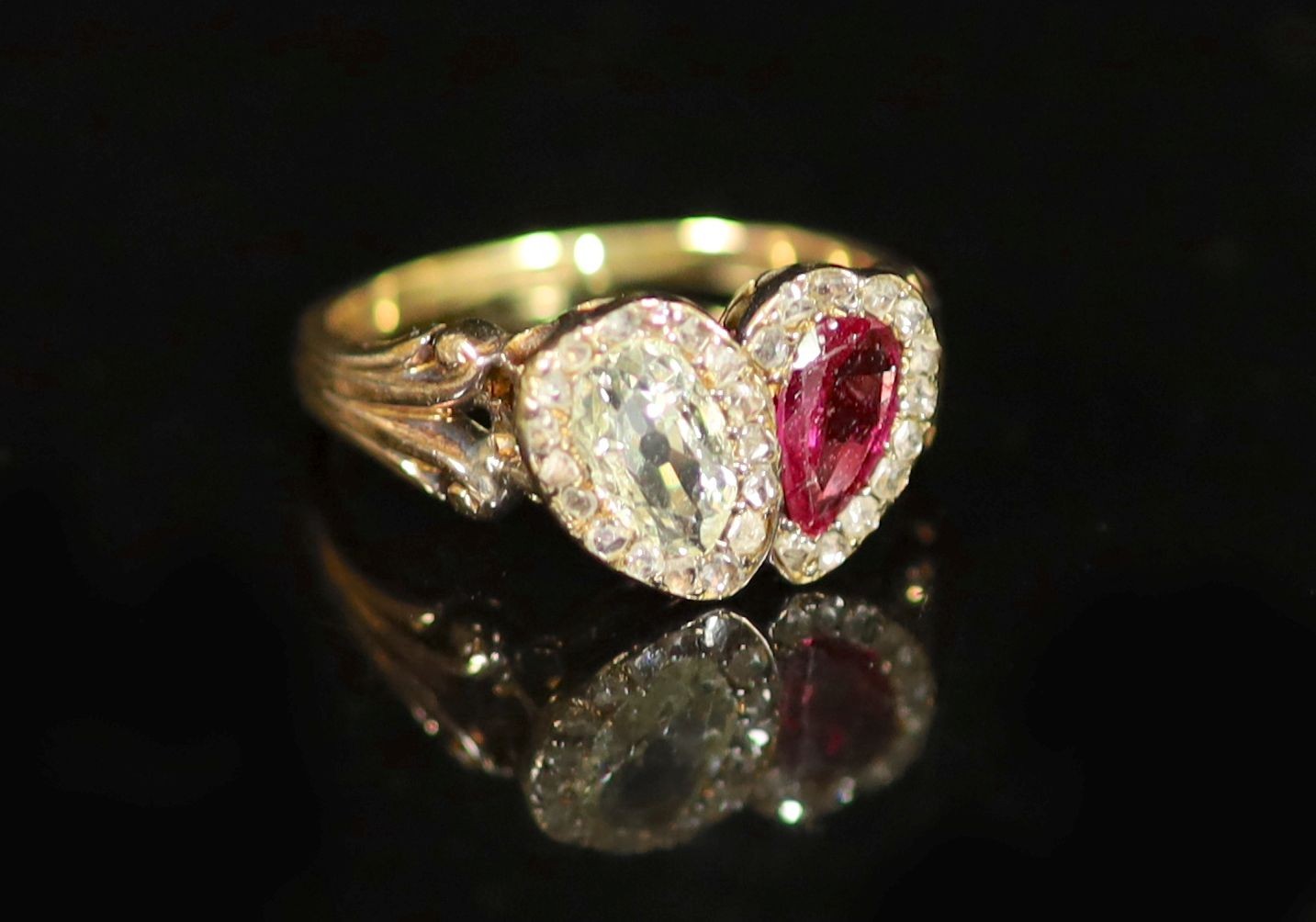 A 19th century gold two stone pear cut ruby and diamond set ring                                                                                                                                                            