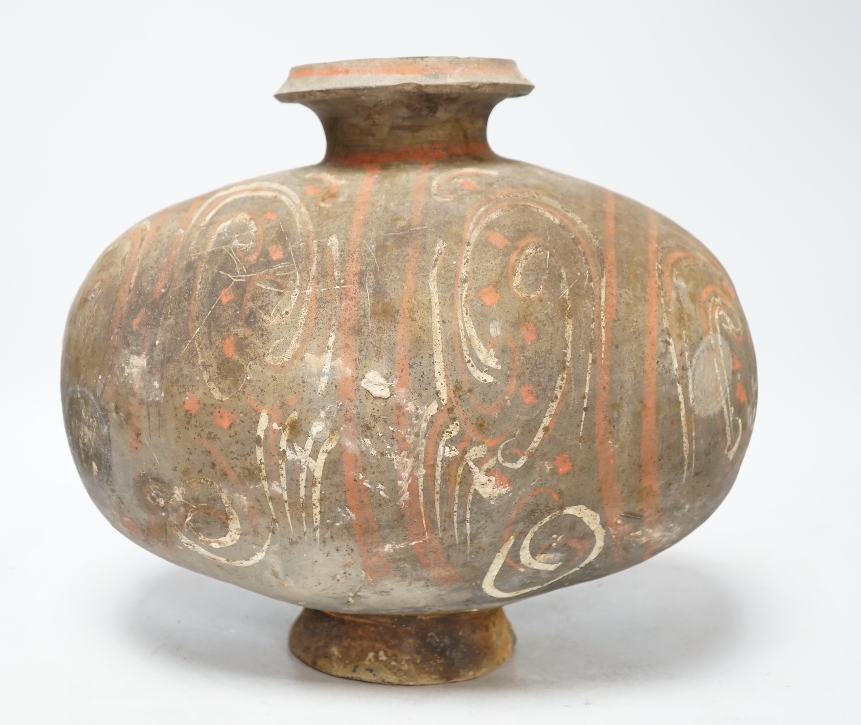 A Chinese pigment painted 'cocoon' jar, Han dynasty, 26cm high                                                                                                                                                              