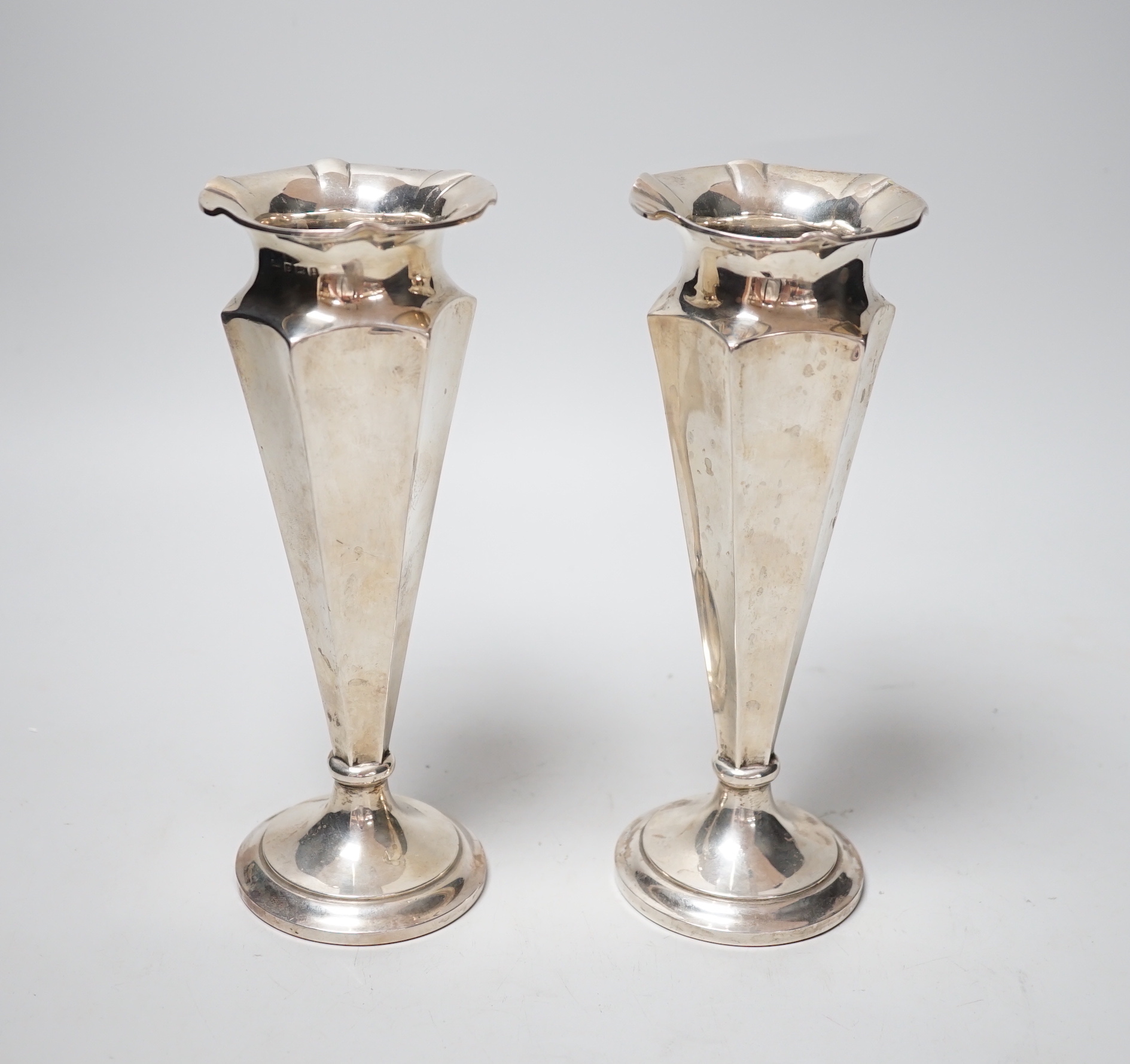 A pair of George V silver mounted spill vases, Deakin & Francis, Birmingham, 1910, height 20.4cm, weighted.                                                                                                                 
