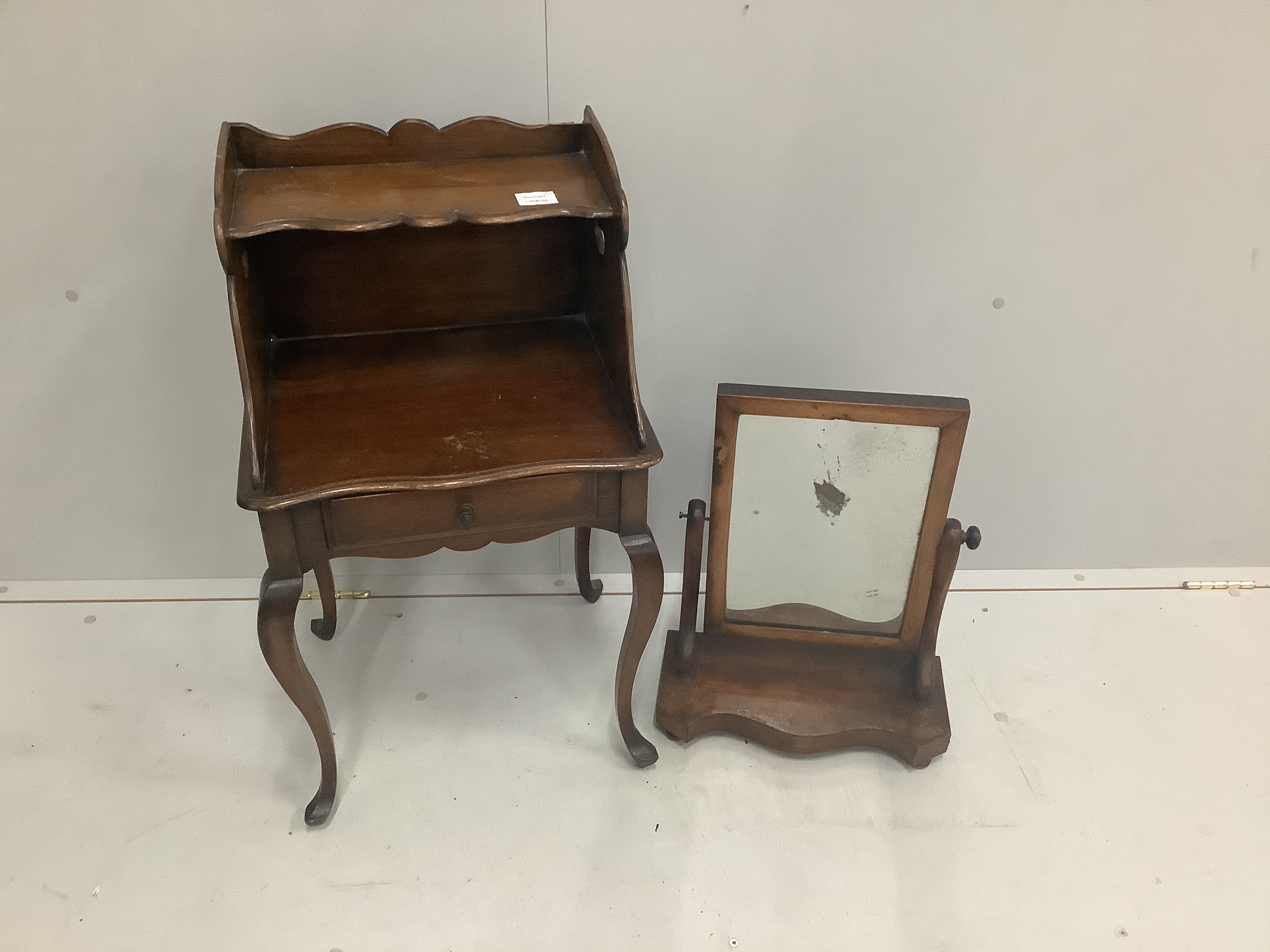 A two tier mahogany bedside table with single drawer, width 43cm, depth 36cm, height 74cm together with a Victorian serpentine mahogany toilet mirror                                                                       