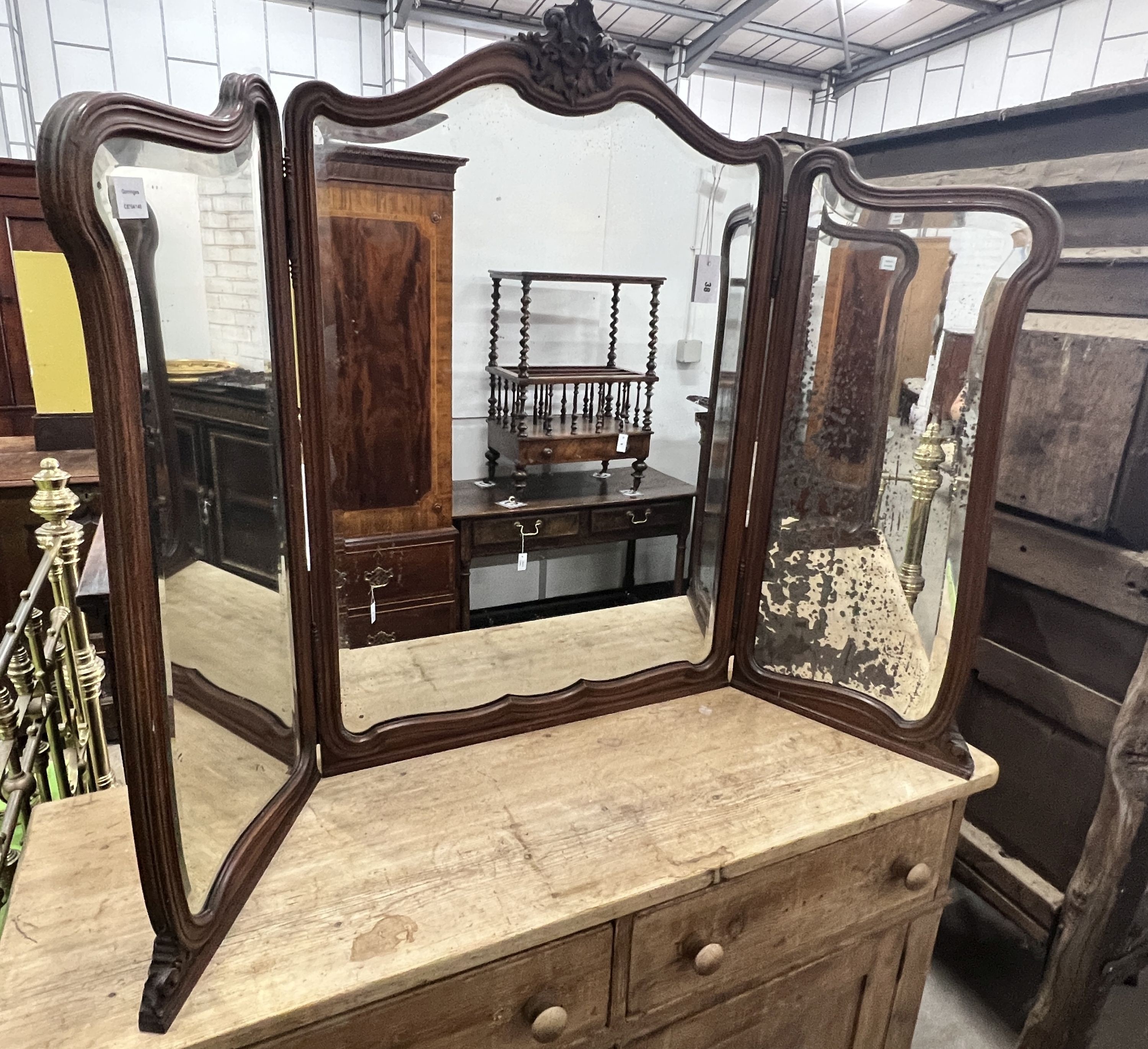 An early 20th century French carved walnut folding triple dressing table mirror, height 106cm                                                                                                                               