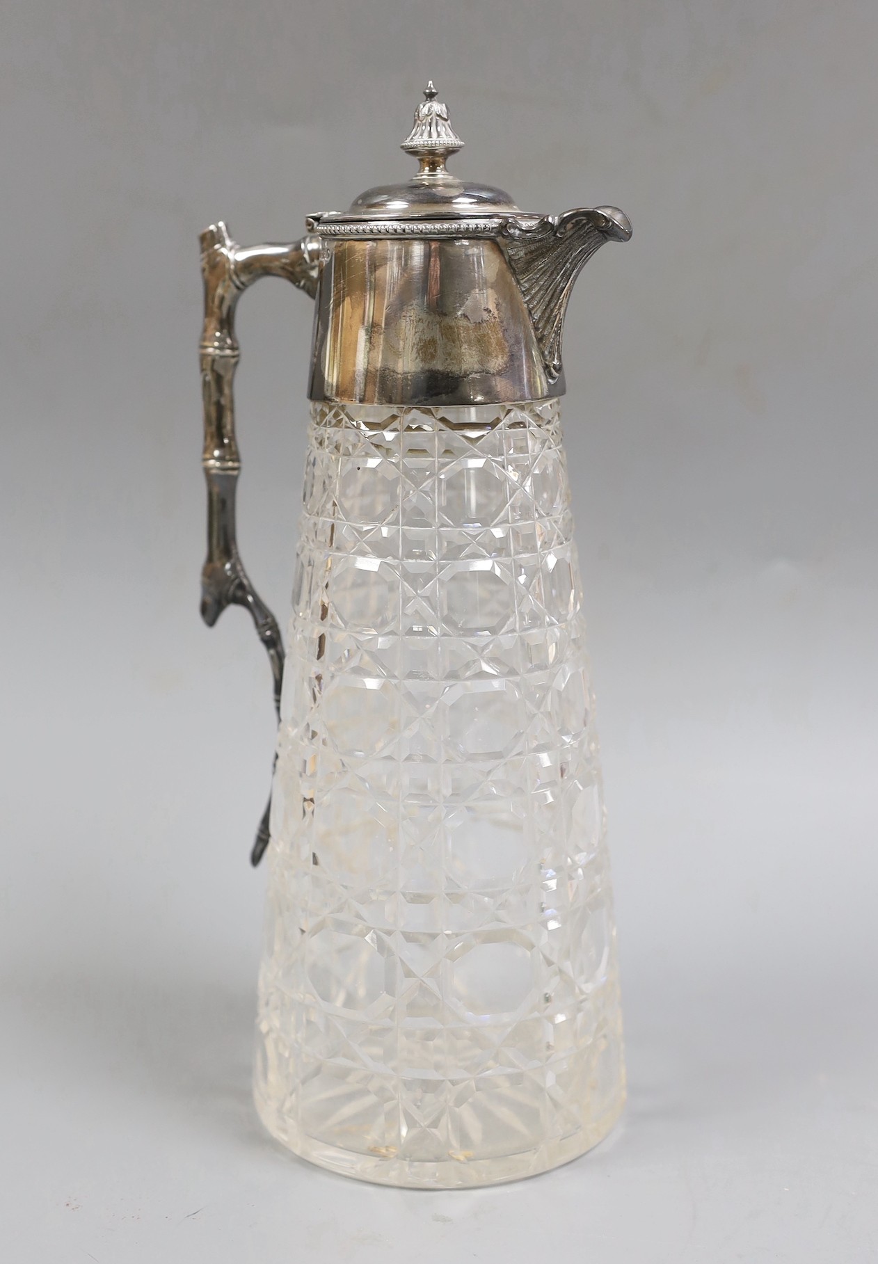 A late Victorian silver mounted cut glass claret jug, Goldsmiths & Silversmiths Co, Sheffield, 1897, height 27cm.                                                                                                           