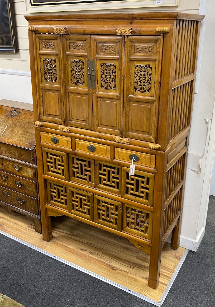 A 19th-century Chinese cypress wood side cabinet, width 106cm, depth 51cm, height 177cm                                                                                                                                     