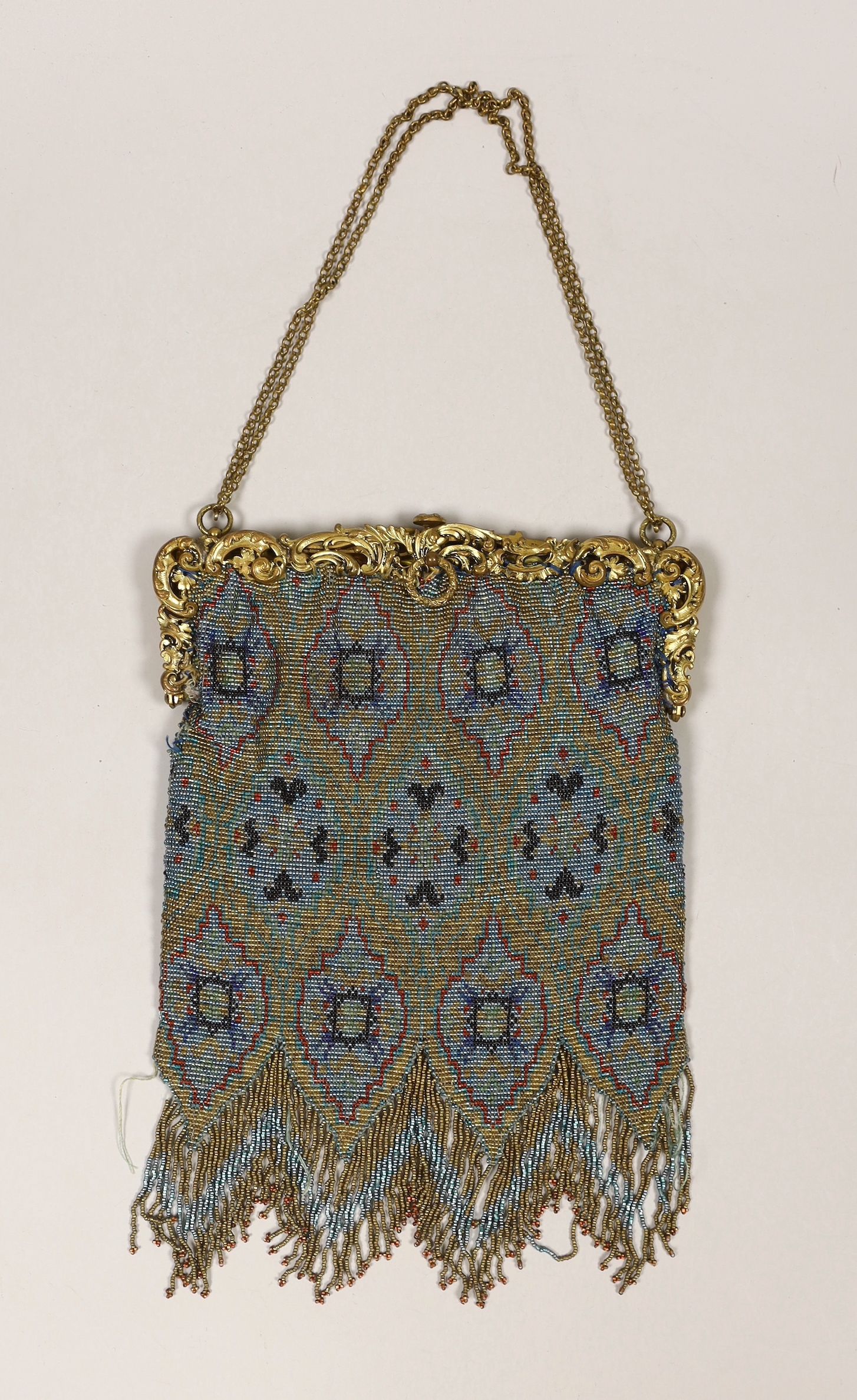 A late 19th century French gilt metal mounted coloured beaded evening bag, 17cm wide                                                                                                                                        