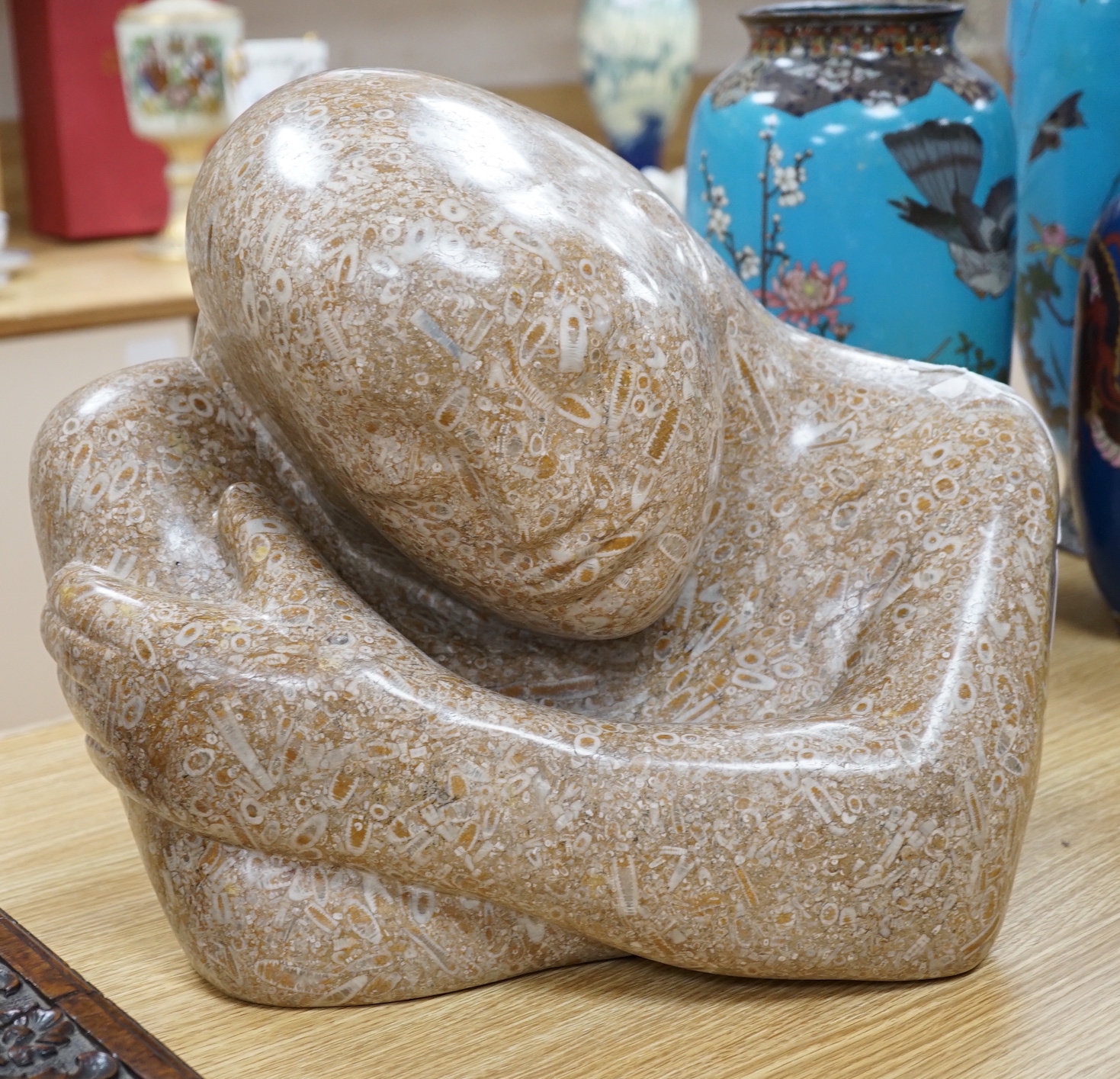 Polly Ionides (b. 1944), a Swaledale fossil stone bust of a lady, ‘Daydream’, 41cm wide                                                                                                                                     