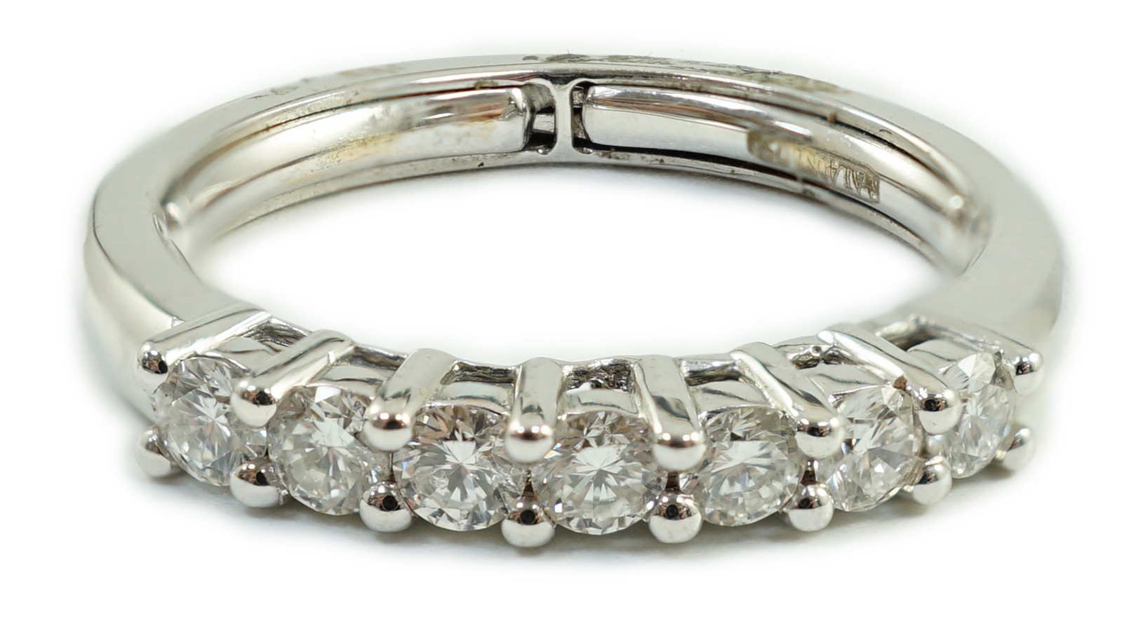 A modern Italian 18ct white gold and seven stone diamond set half hoop ring, size N, gross weight 3.9 grams.                                                                                                                