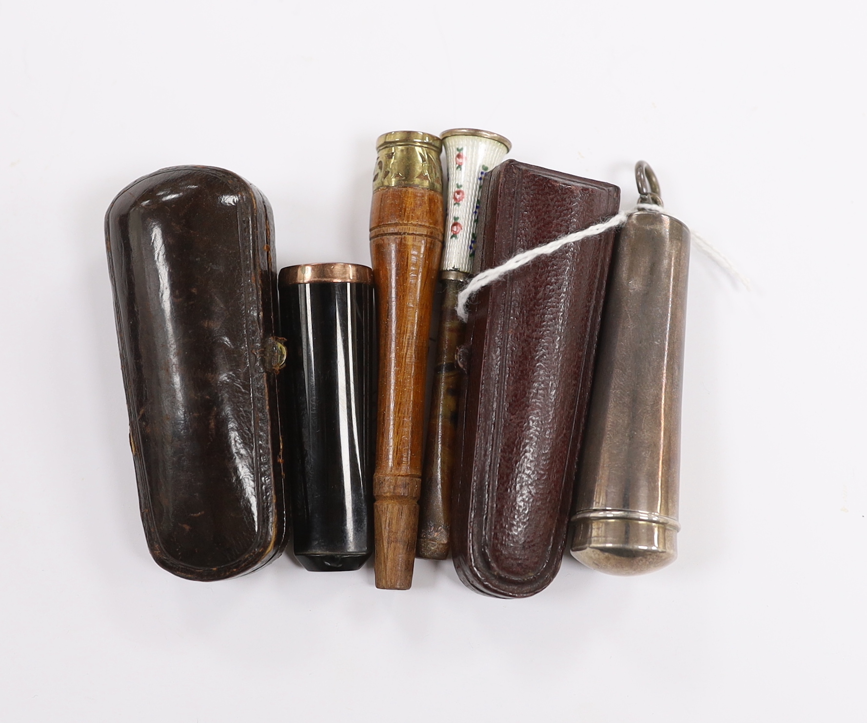 A silver cheroot holder case and others                                                                                                                                                                                     