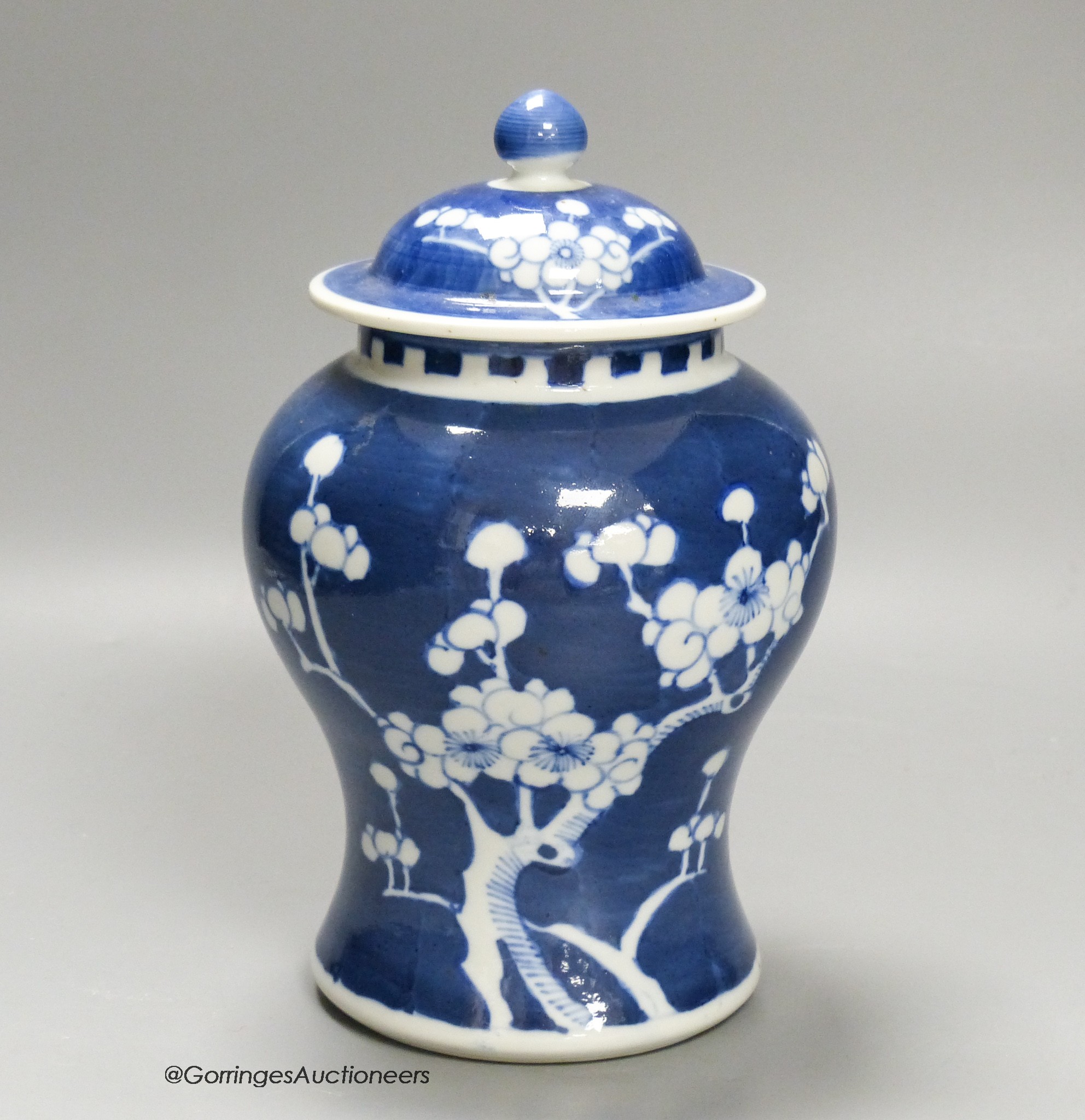 A Chinese blue and white 'prunus' jar and cover, height 22cm                                                                                                                                                                