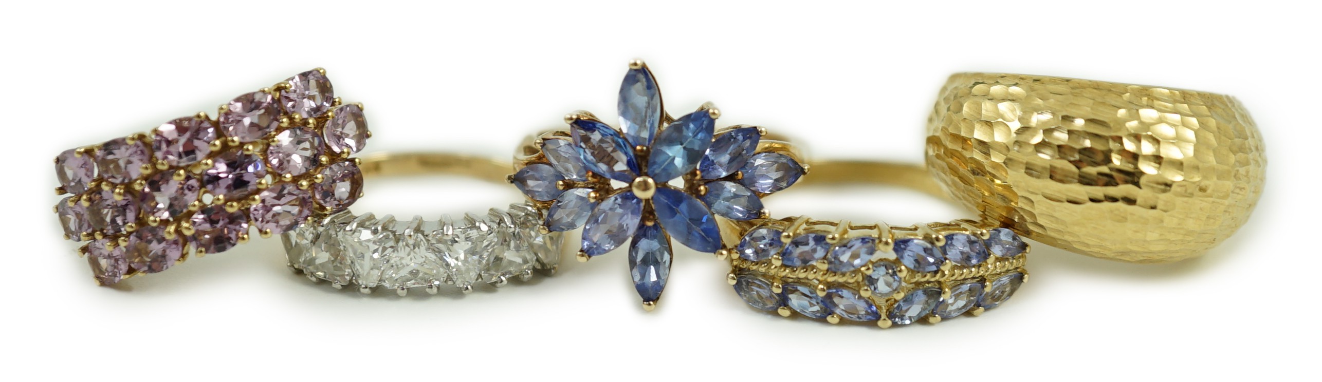 Four assorted modern 9ct gold and gem set rings and an Italian 375 ring, gross weight 14.4 grams.                                                                                                                           