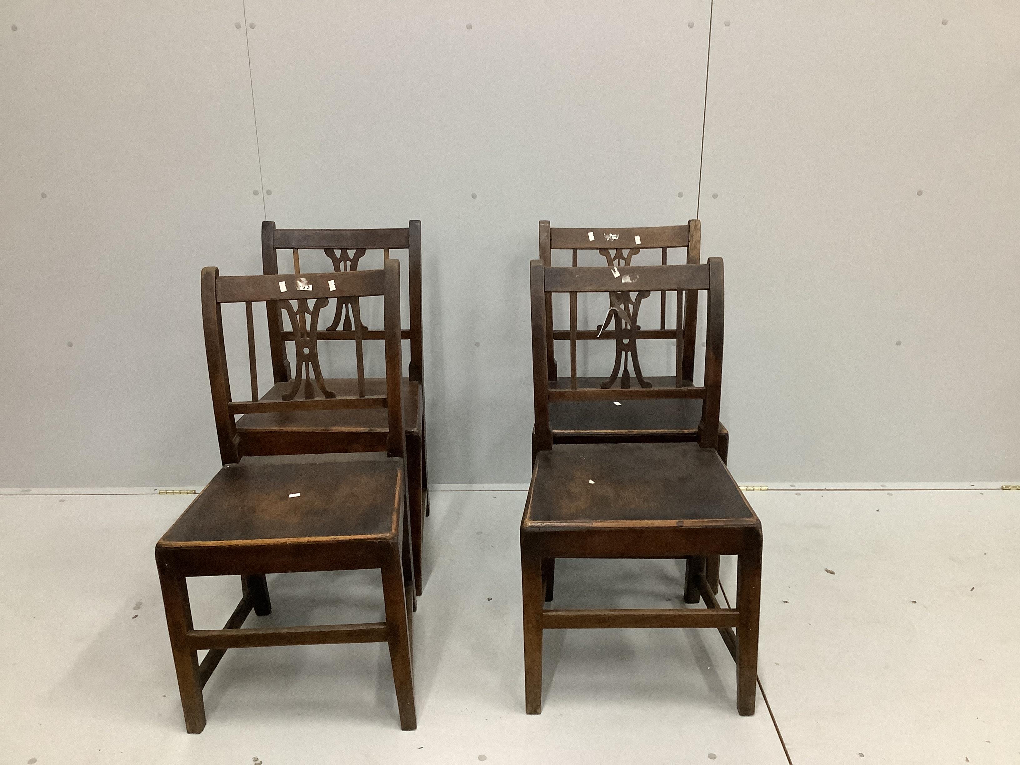 A set of four early 19th century and later provincial oak wood seat dining chairs                                                                                                                                           
