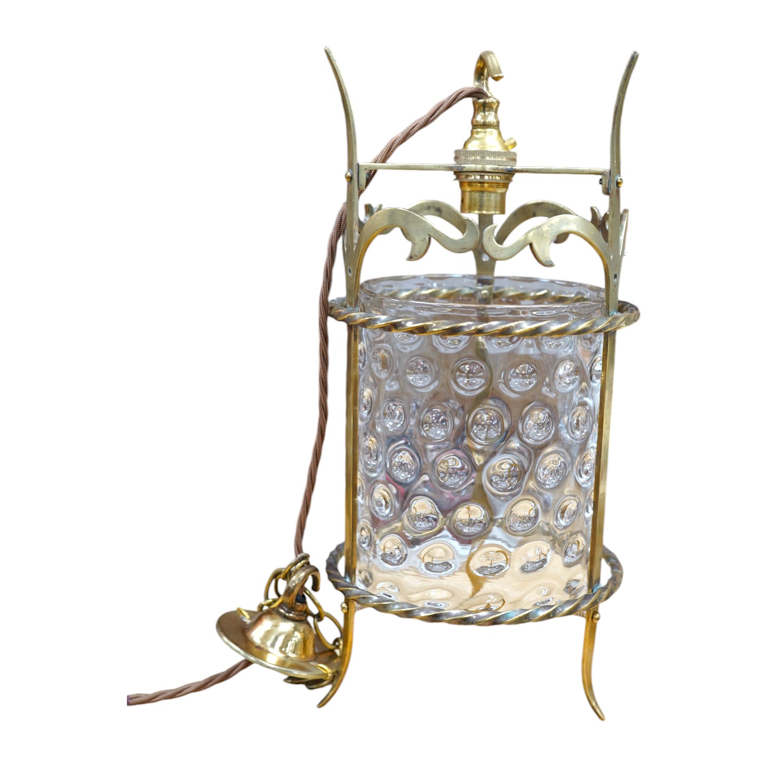 An English Art Nouveau brass lantern with wavy bubbly glass cylinder, c.1910-1920's, including chain and ceiling rose, wired, lantern 34cm high, diameter 13.5cm, glass 16.5cm high. Condition - glass shade a little loose 