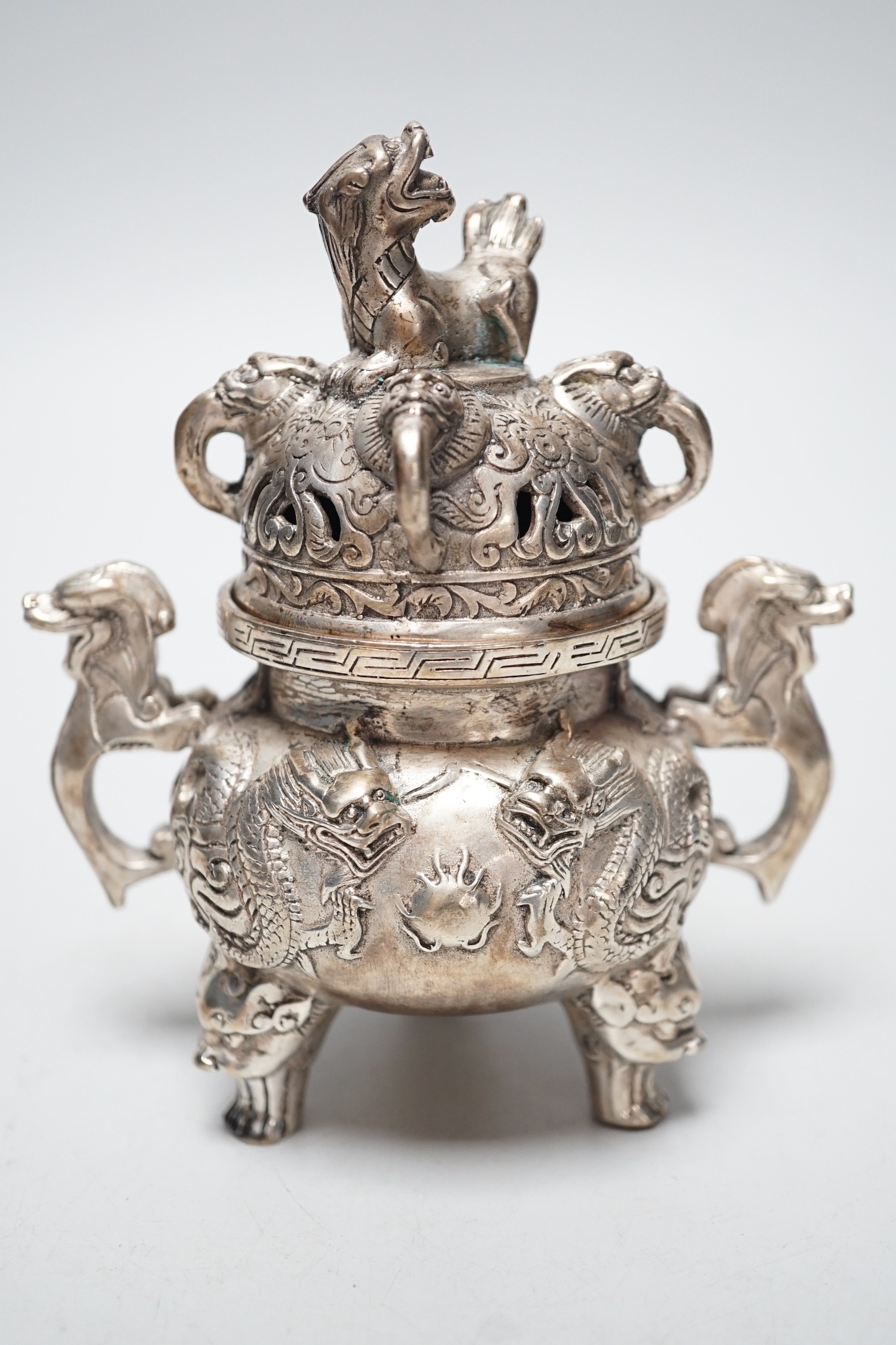 A Chinese cast metal censer and cover, seal mark to base. 13cm tall                                                                                                                                                         