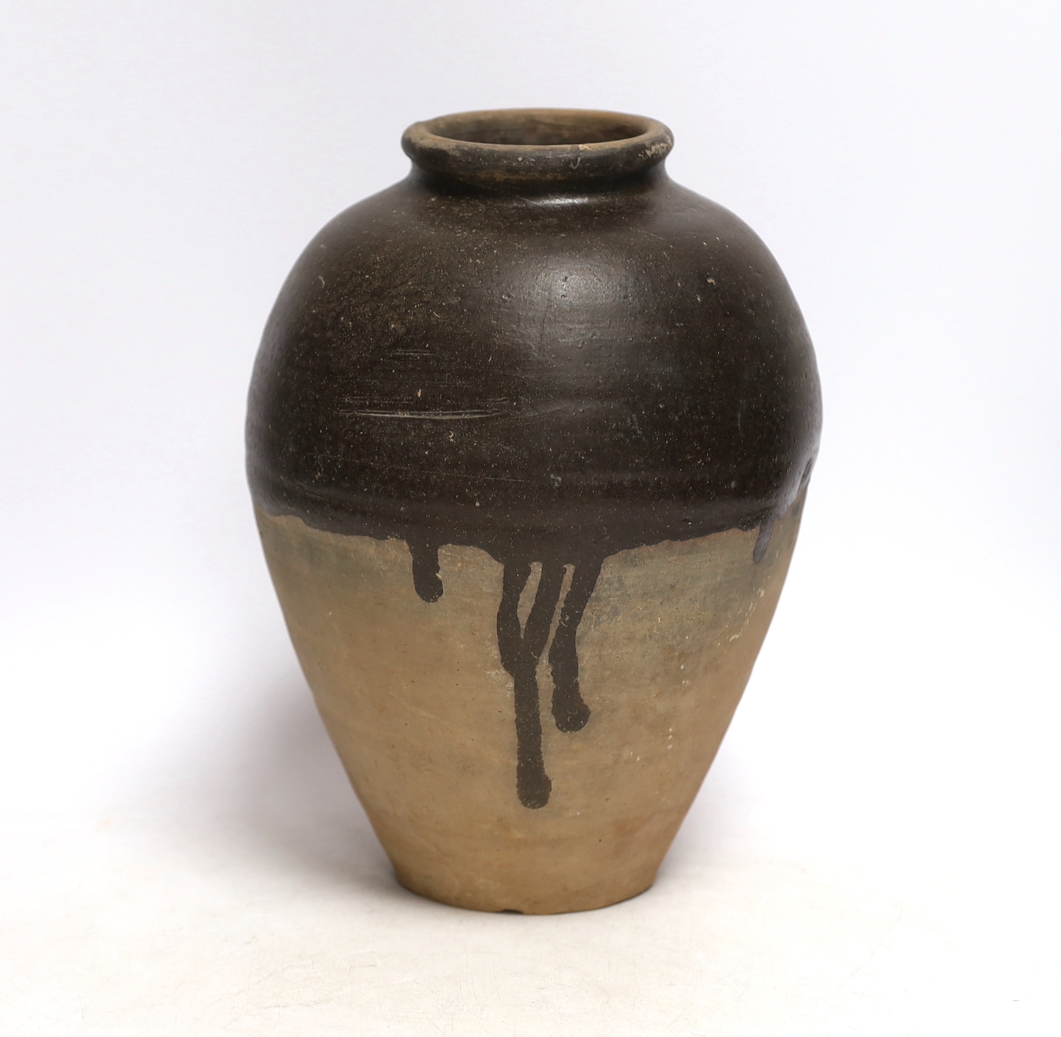 A Chinese brown partially glazed jar, Tang dynasty, 26cm                                                                                                                                                                    