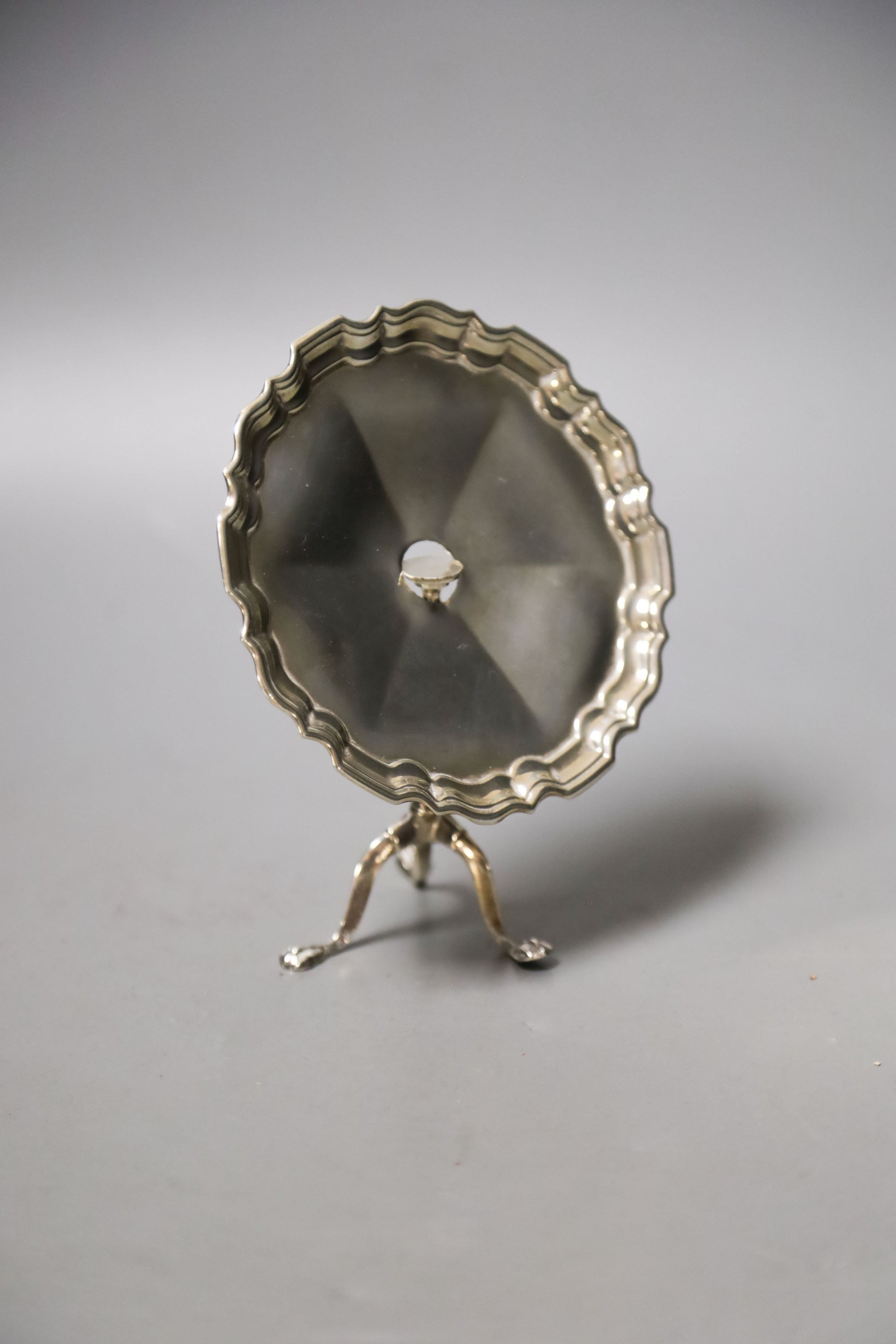 A George V silver miniature model of an occasional table(a.f.), Goldsmiths & Silversmiths Co Ltd, London, 1910, height 9.6cm, 91 grams.                                                                                     