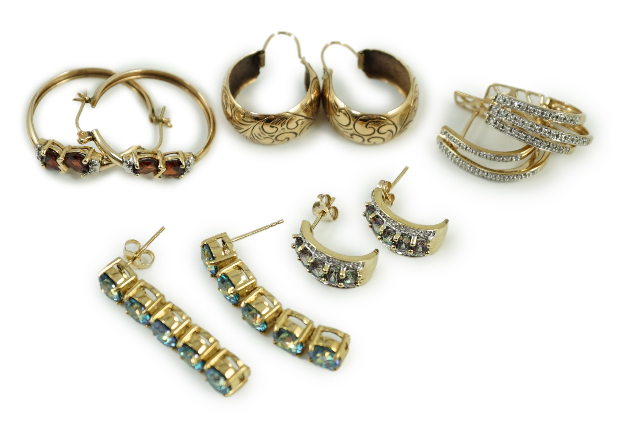 Four assorted modern pairs of 9ct gold and gem set earrings and one pair of yellow metal earrings, gross weight, 23.2 grams.                                                                                                