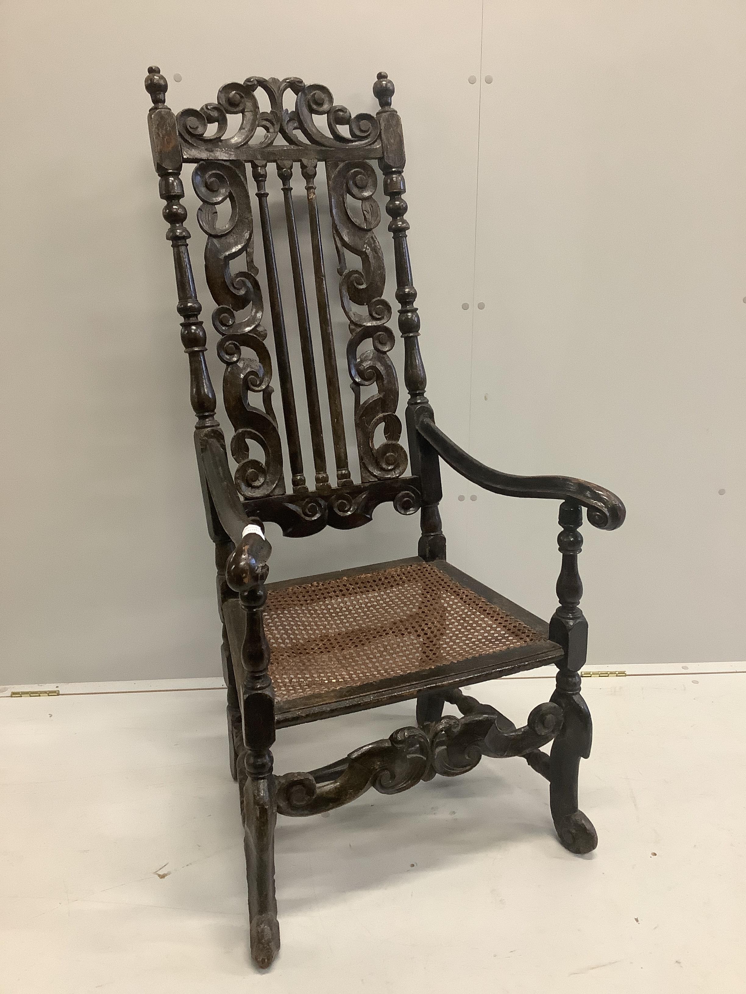 A 17th century and later walnut cane seat high back elbow chair, width 62cm, depth 53cm, height 134cm                                                                                                                       