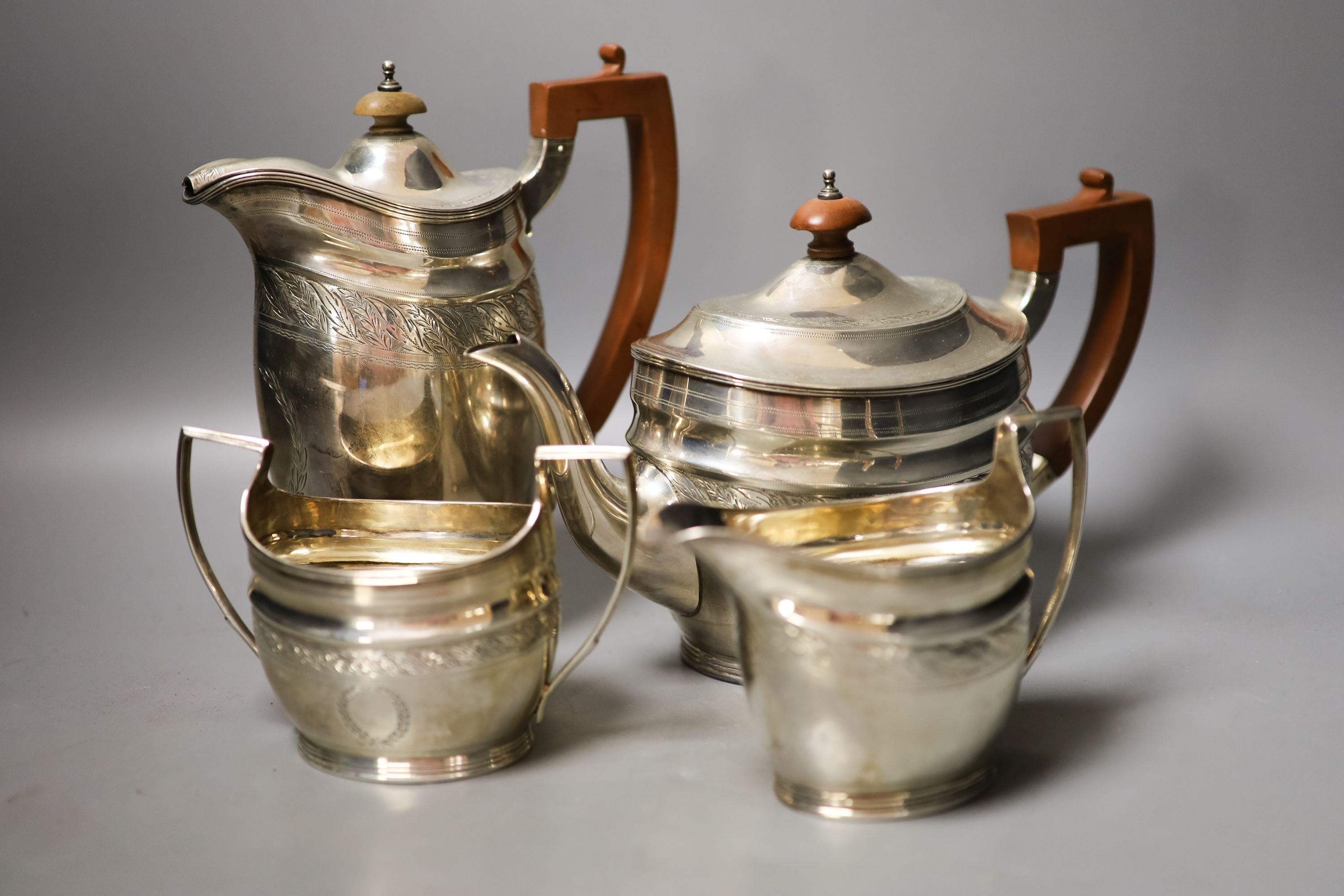 A George V three piece silver oval tea set, London, 1930, together with a similar George III silver cream jug, London, 1800                                                                                                 