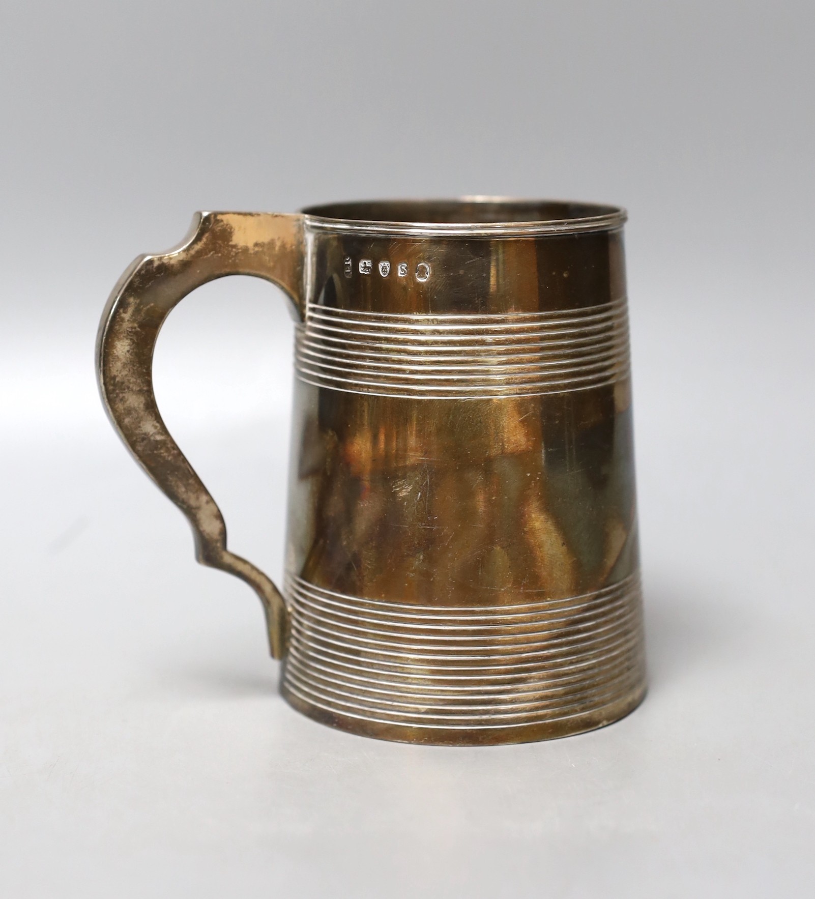 A George III silver mug, with two reeded bands, John Robins, London, 1793, 11.4cm, 363 grams.                                                                                                                               